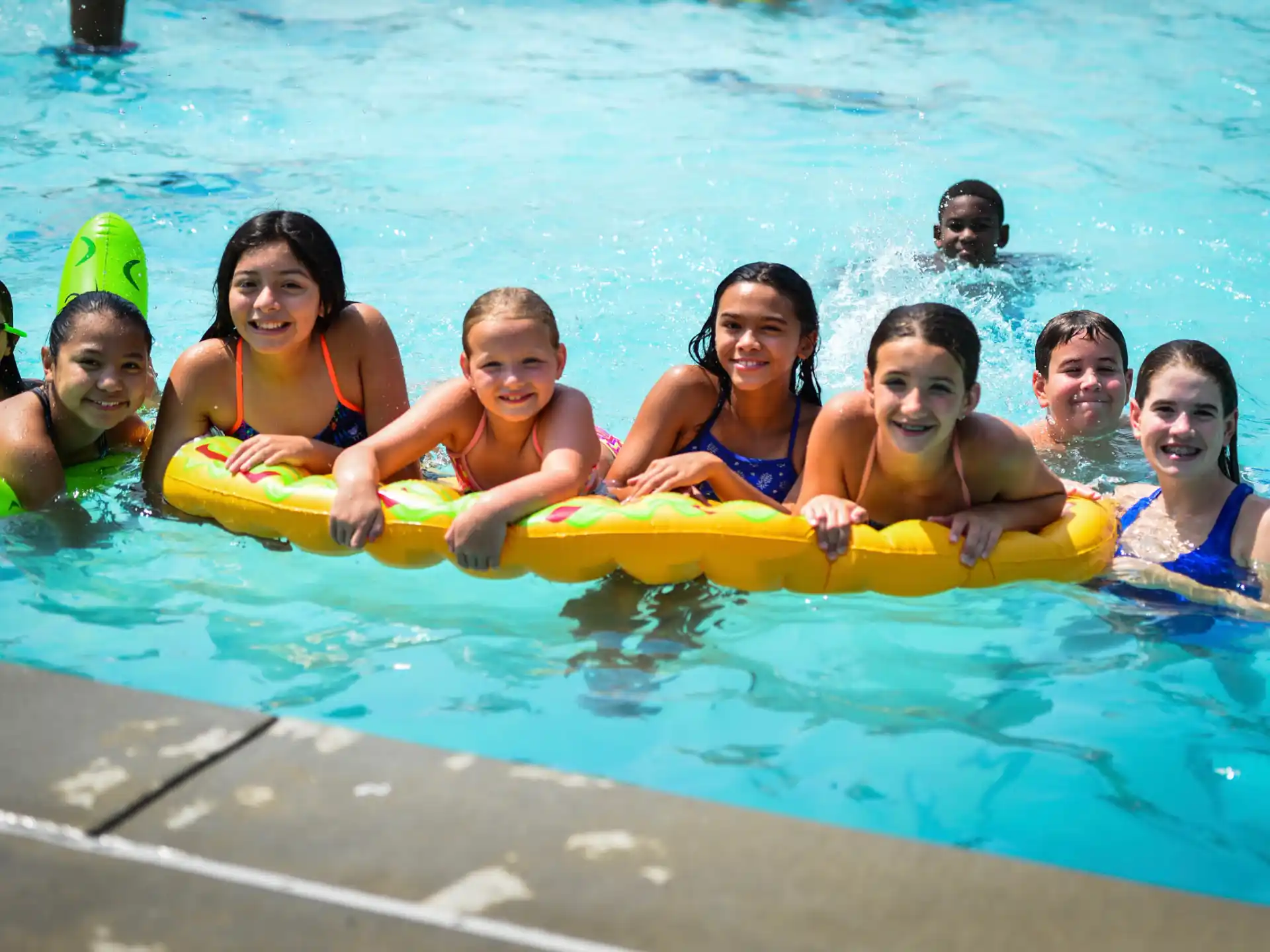 a group of people in a pool