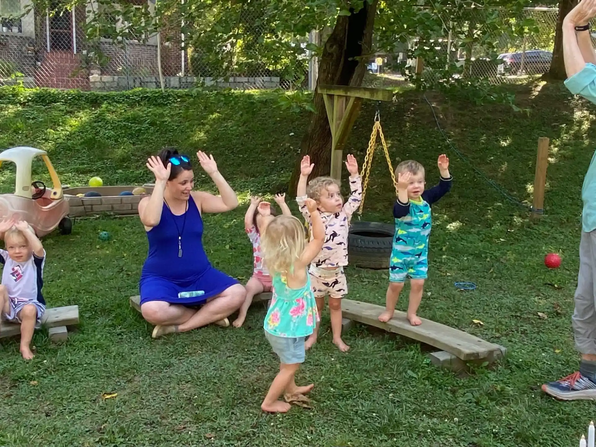 a group of children playing in a yard