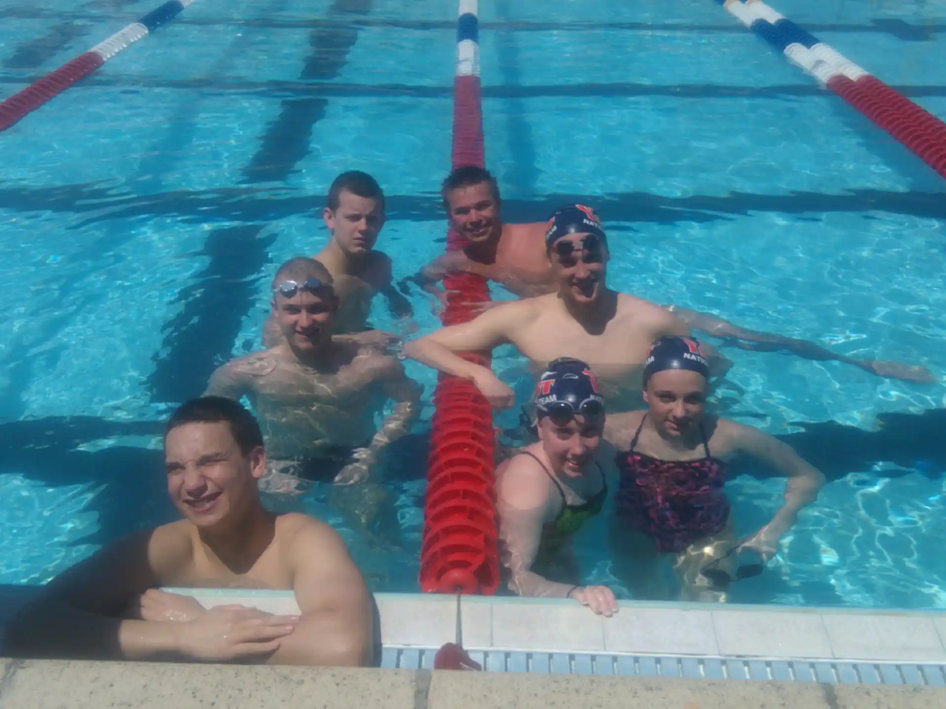 a group of people in a pool