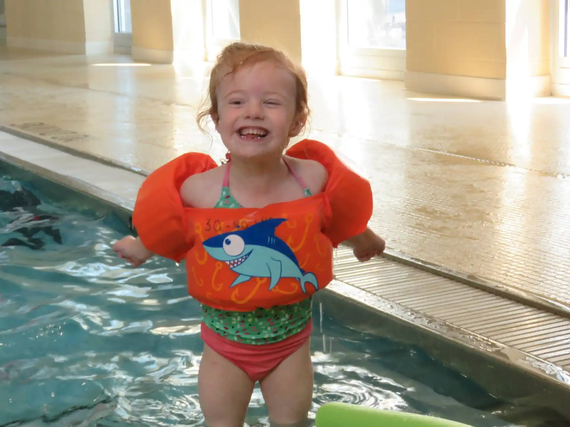a baby in a pool