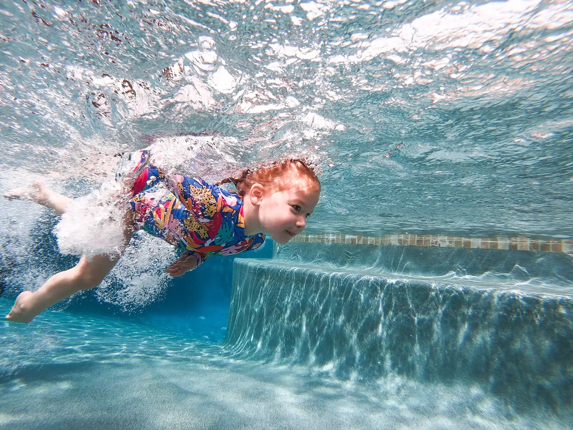 a boy in a pool