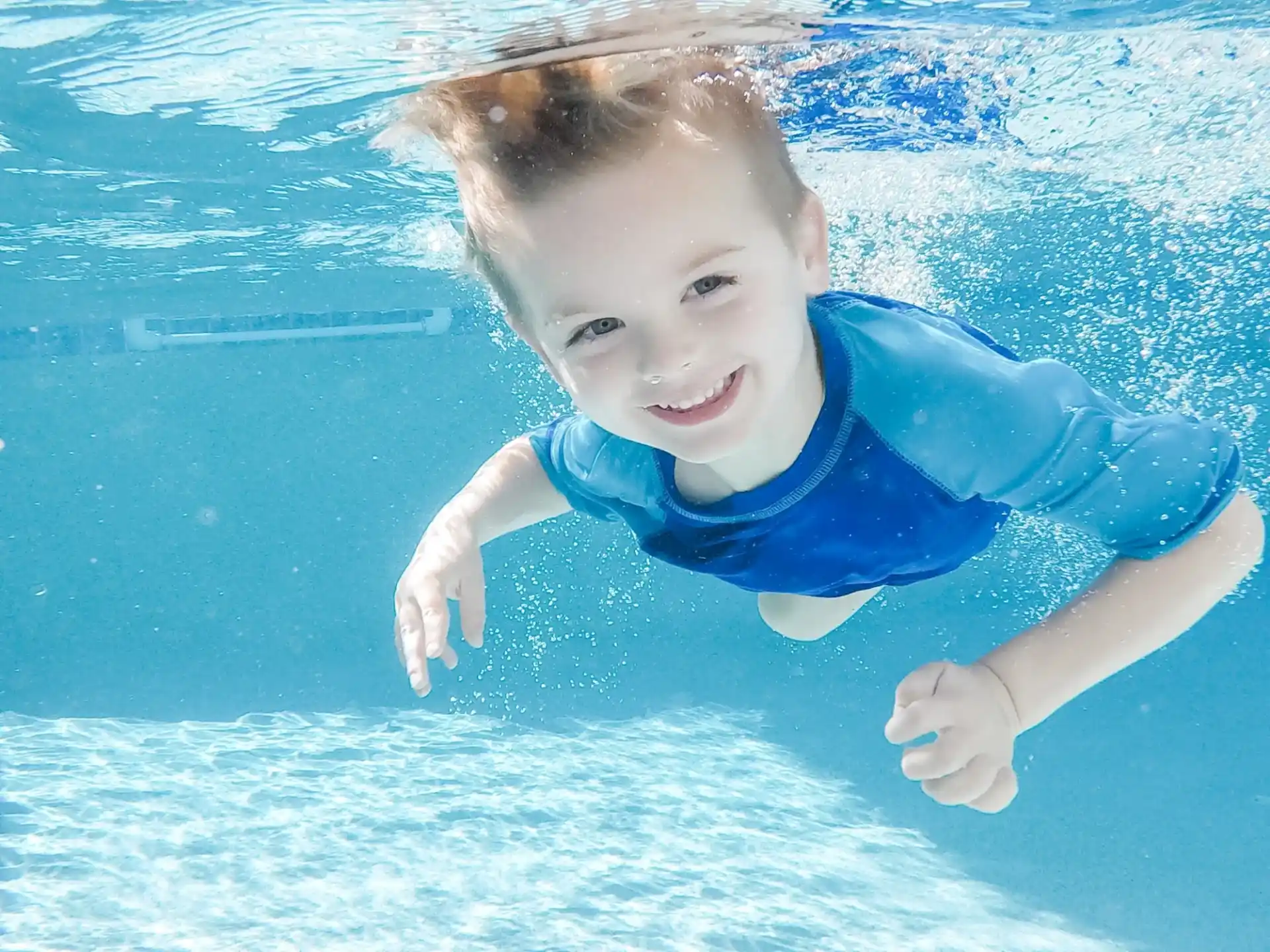 a boy in a pool