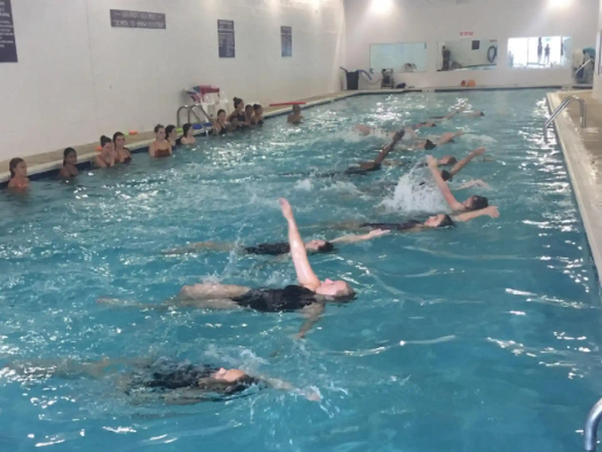 a group of people in a pool