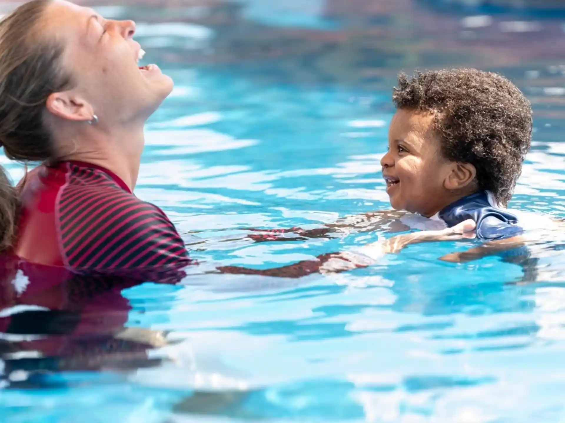 a couple of children in a pool