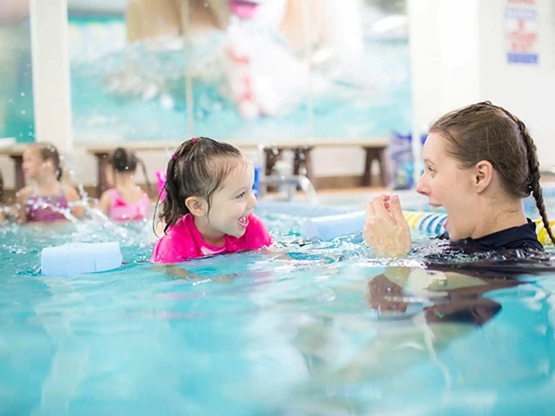 a group of children in a pool