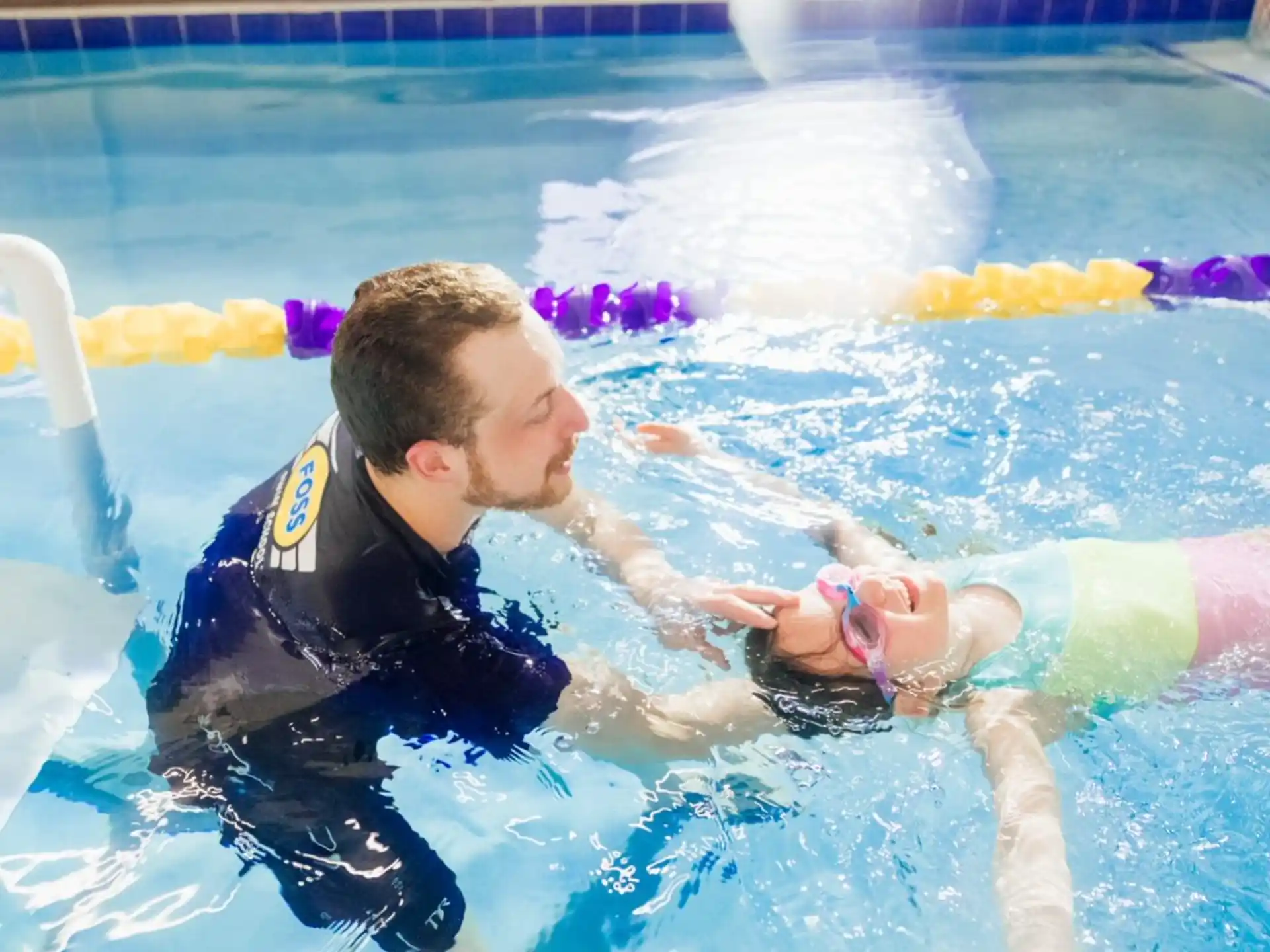 a man and a woman in a pool