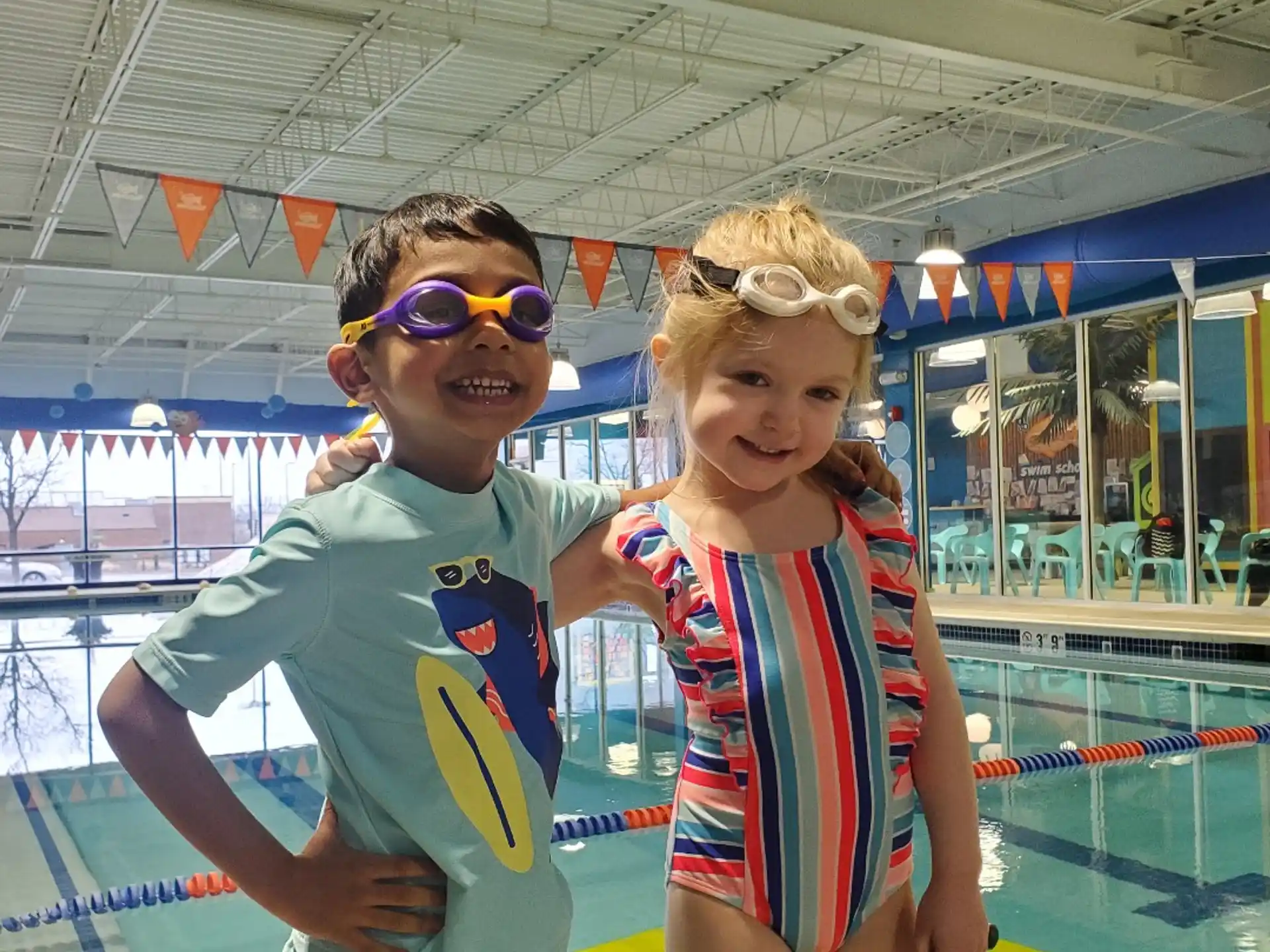 a boy and girl posing for a picture