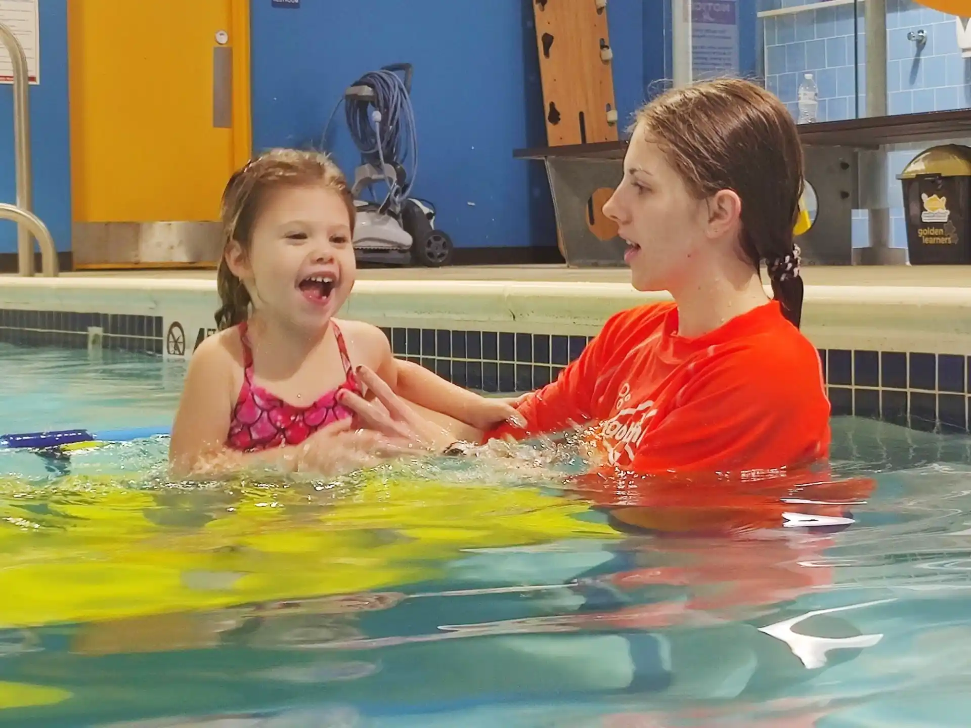 a couple of girls in a pool