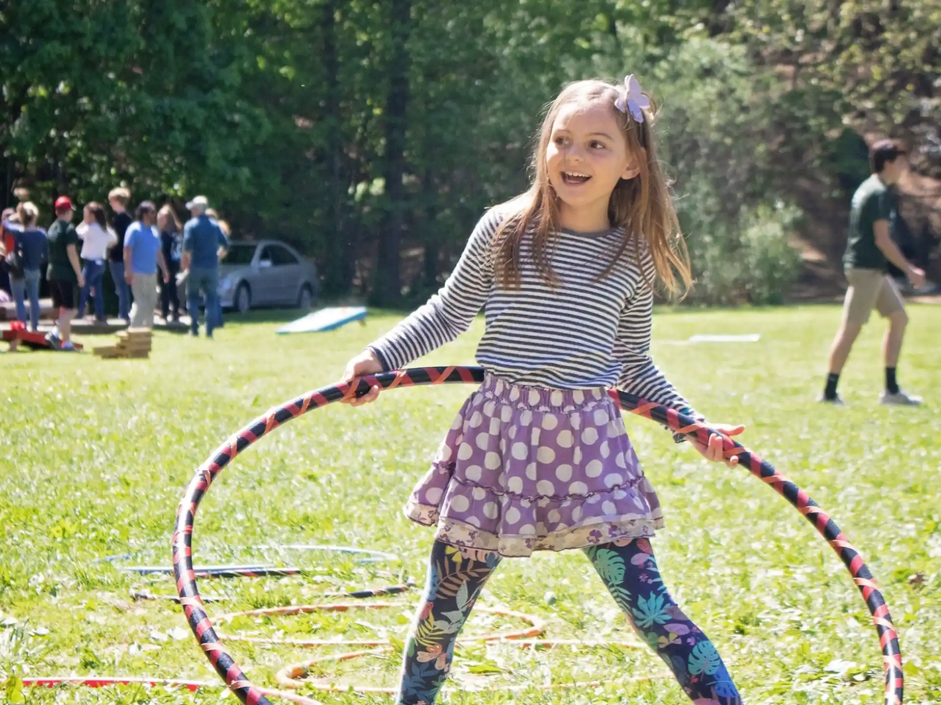 a girl holding a bow and arrow
