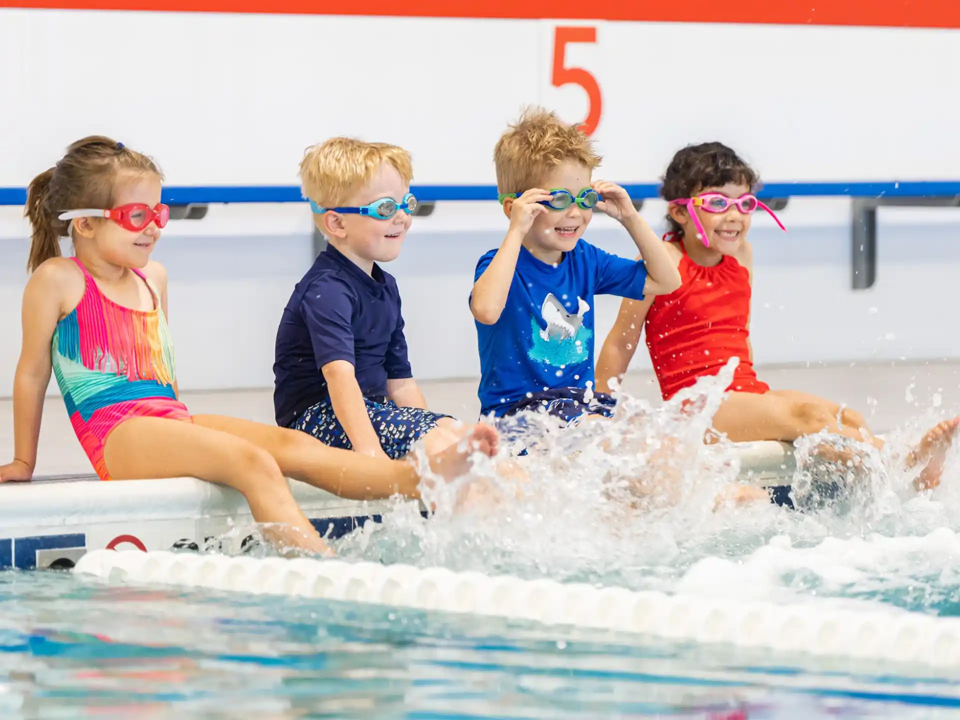 a group of kids in a pool