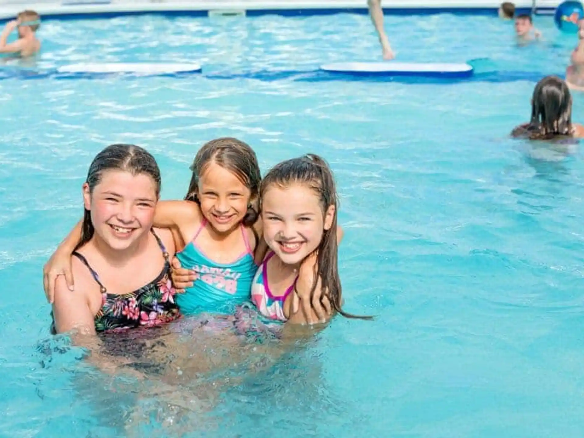 a group of girls in a pool