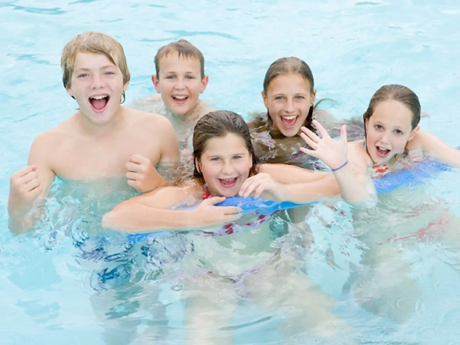 a group of kids in a pool