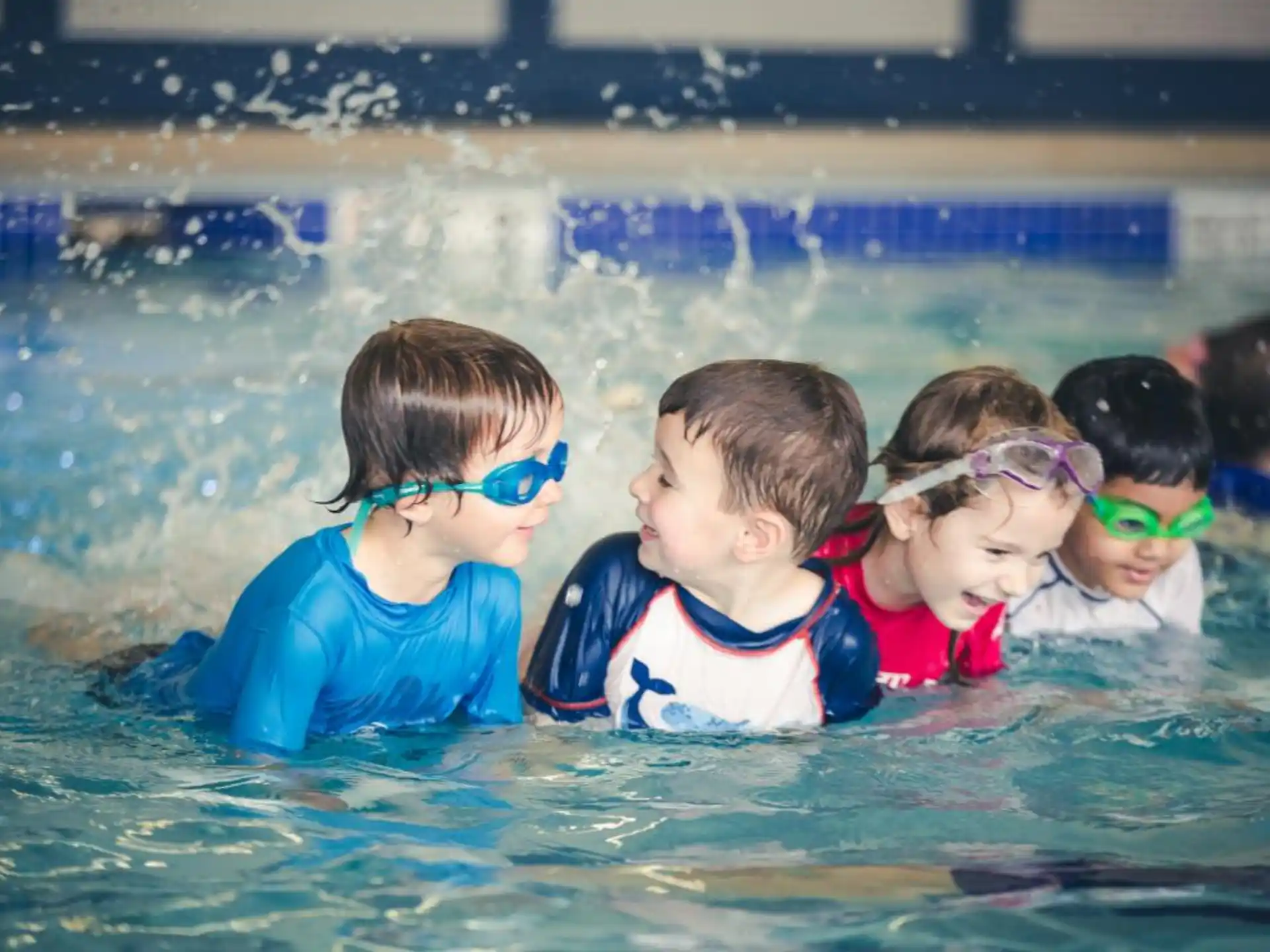 a group of children in a pool