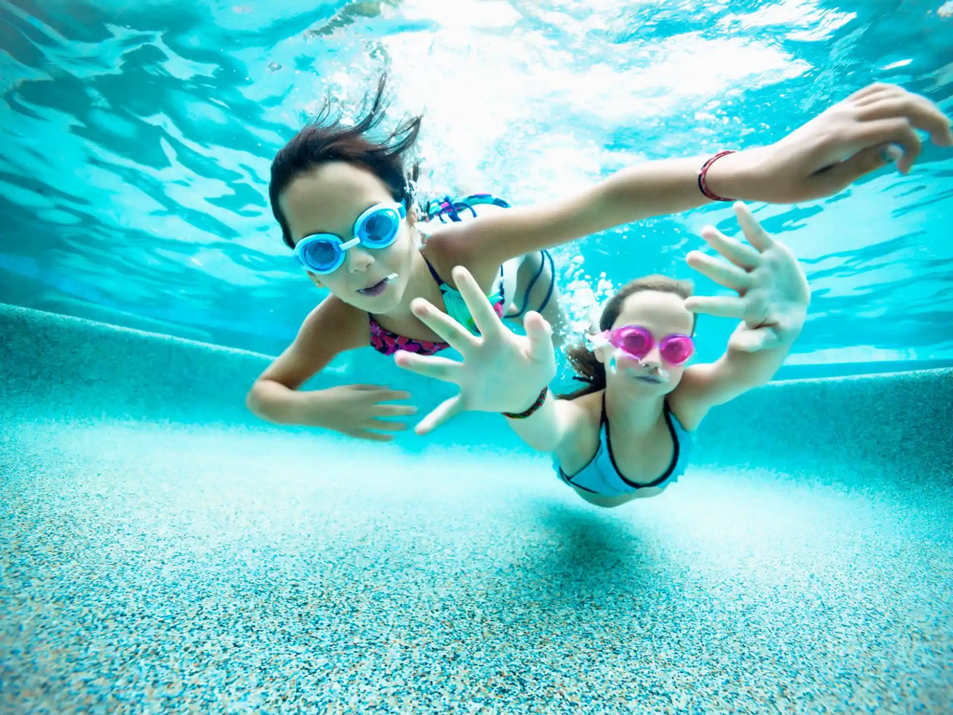 a man and woman in a pool