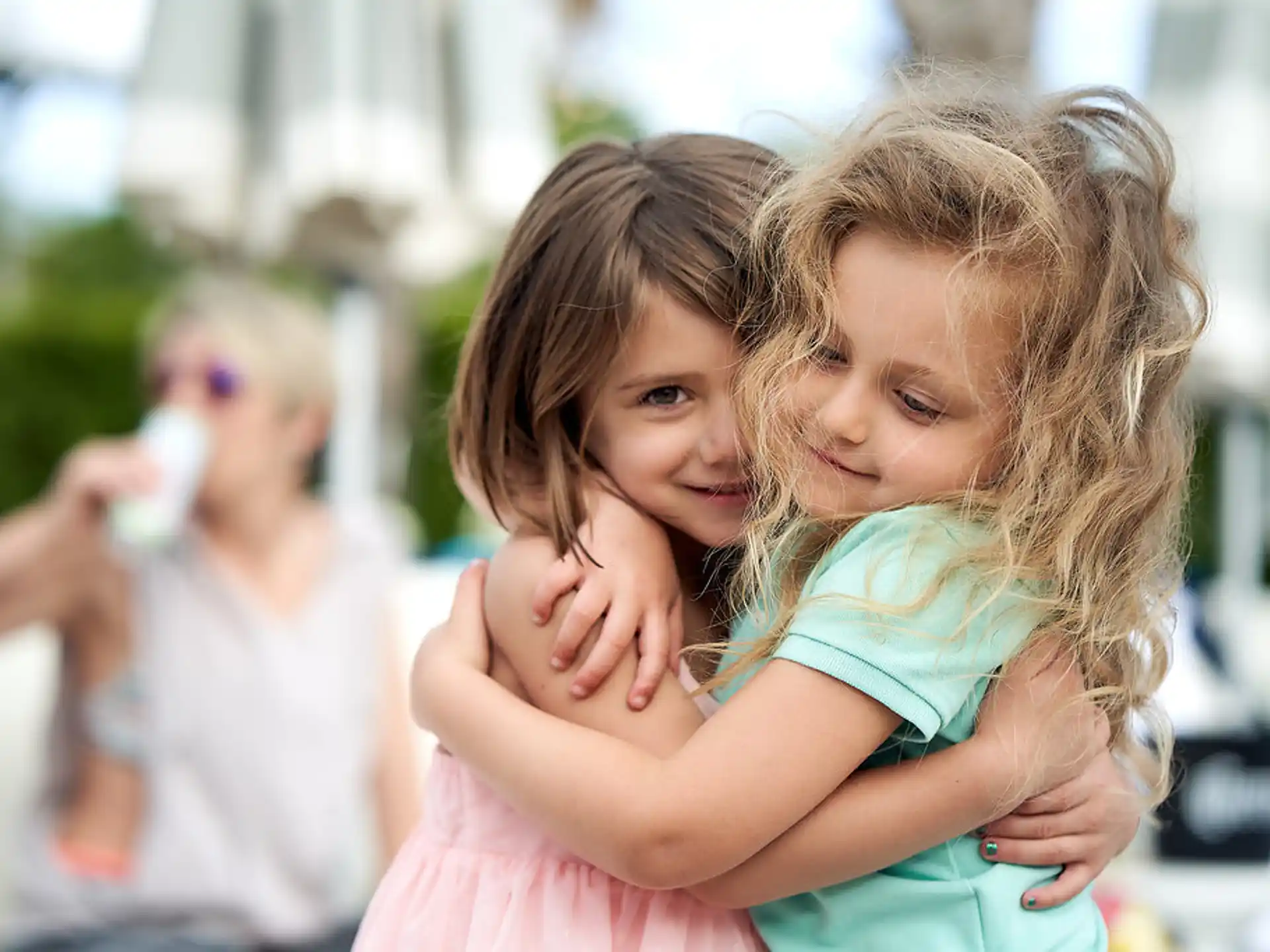 a person holding a child