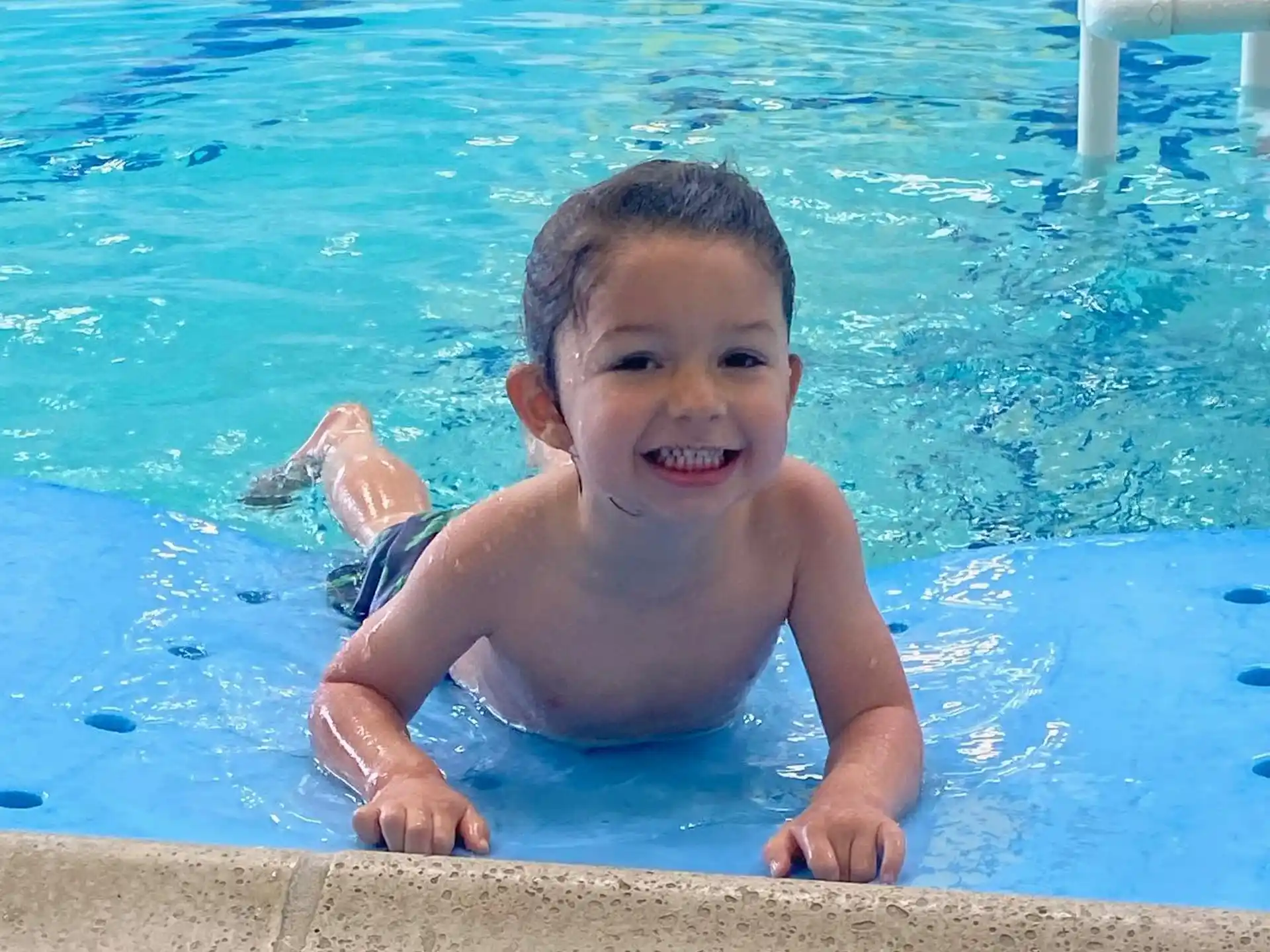 a boy in a pool