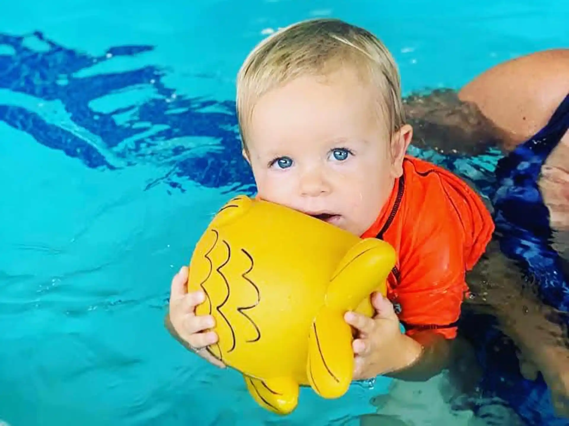 a baby in a pool