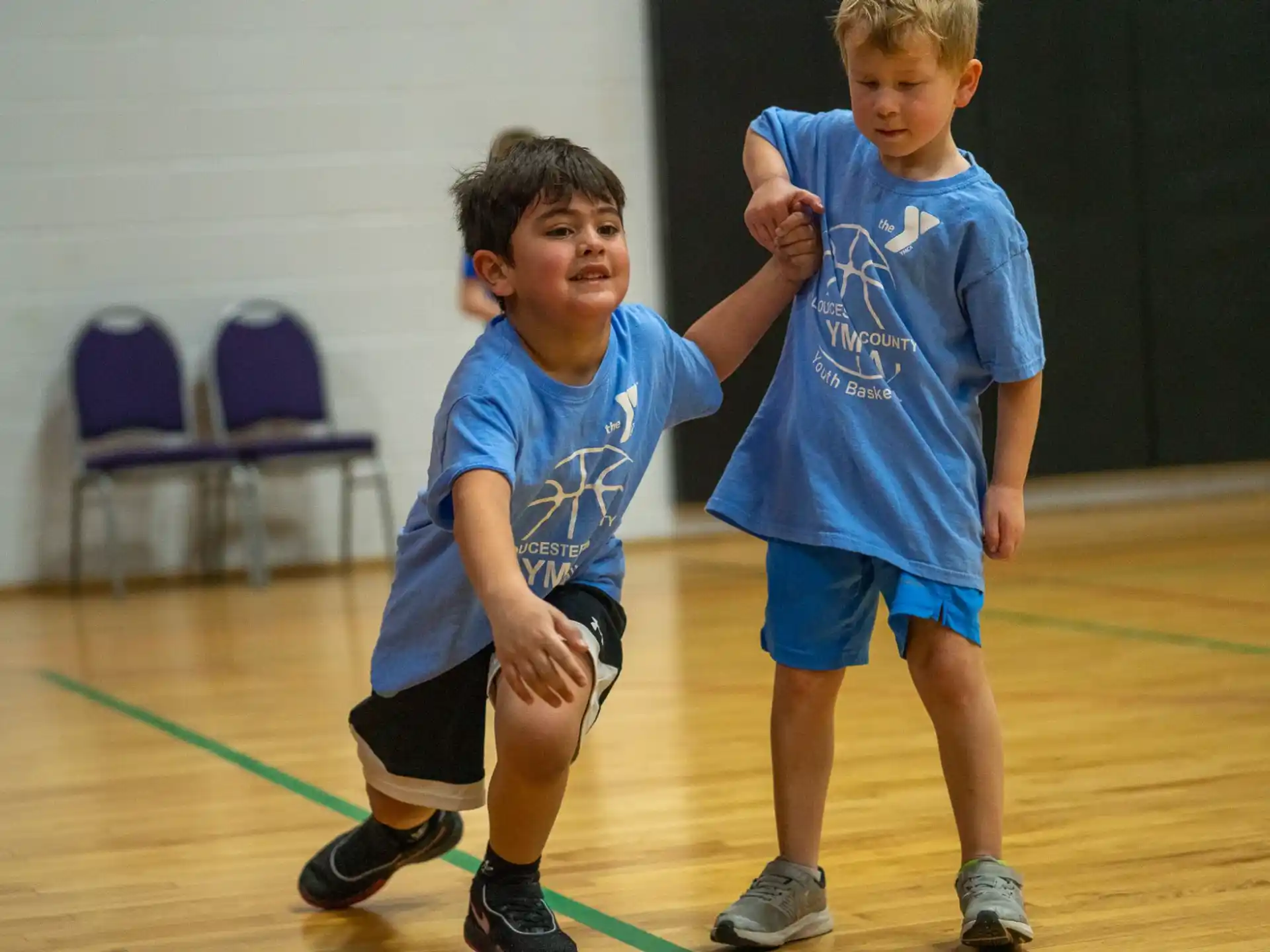 two boys in blue shirts