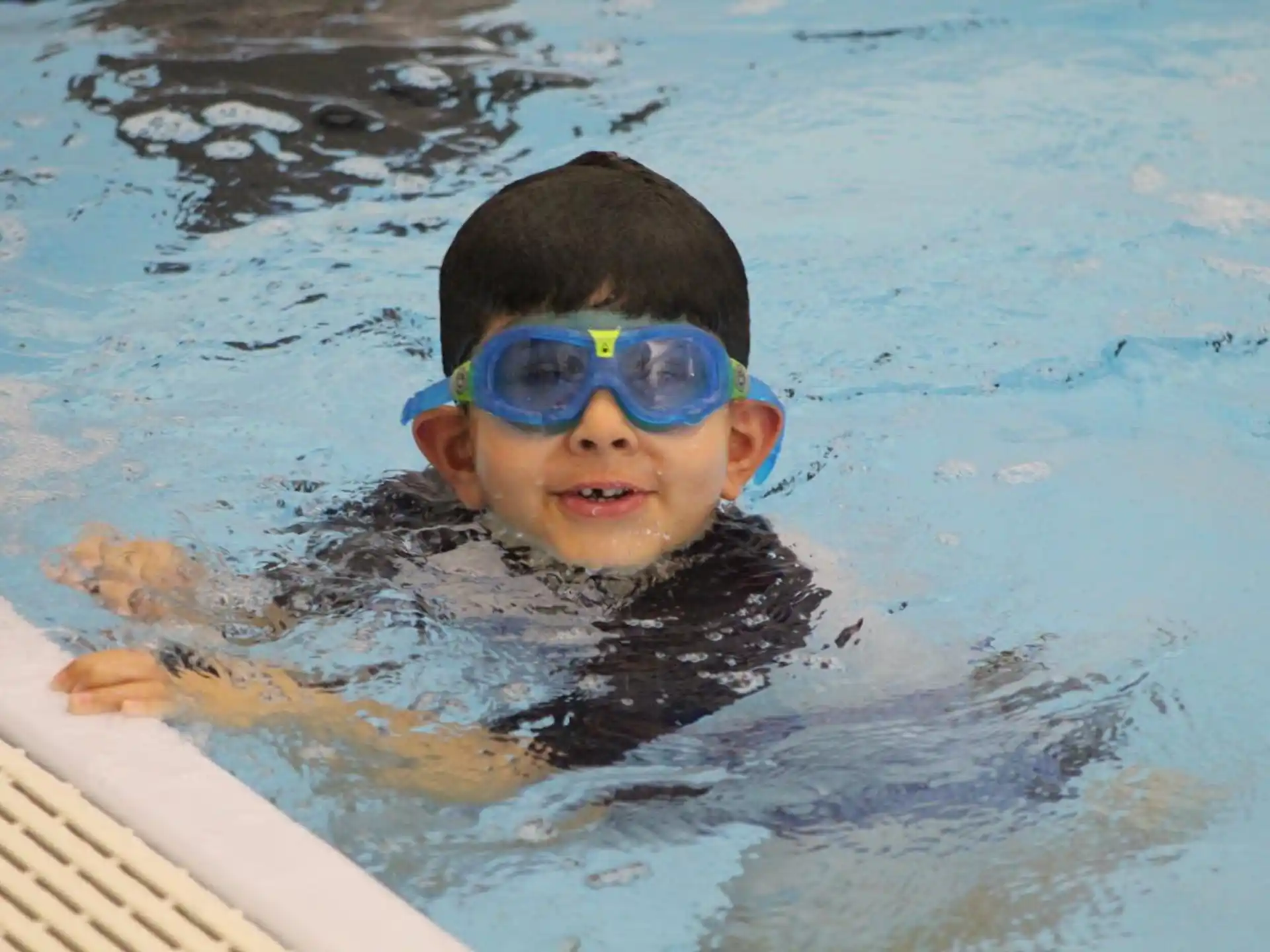 a boy in a pool
