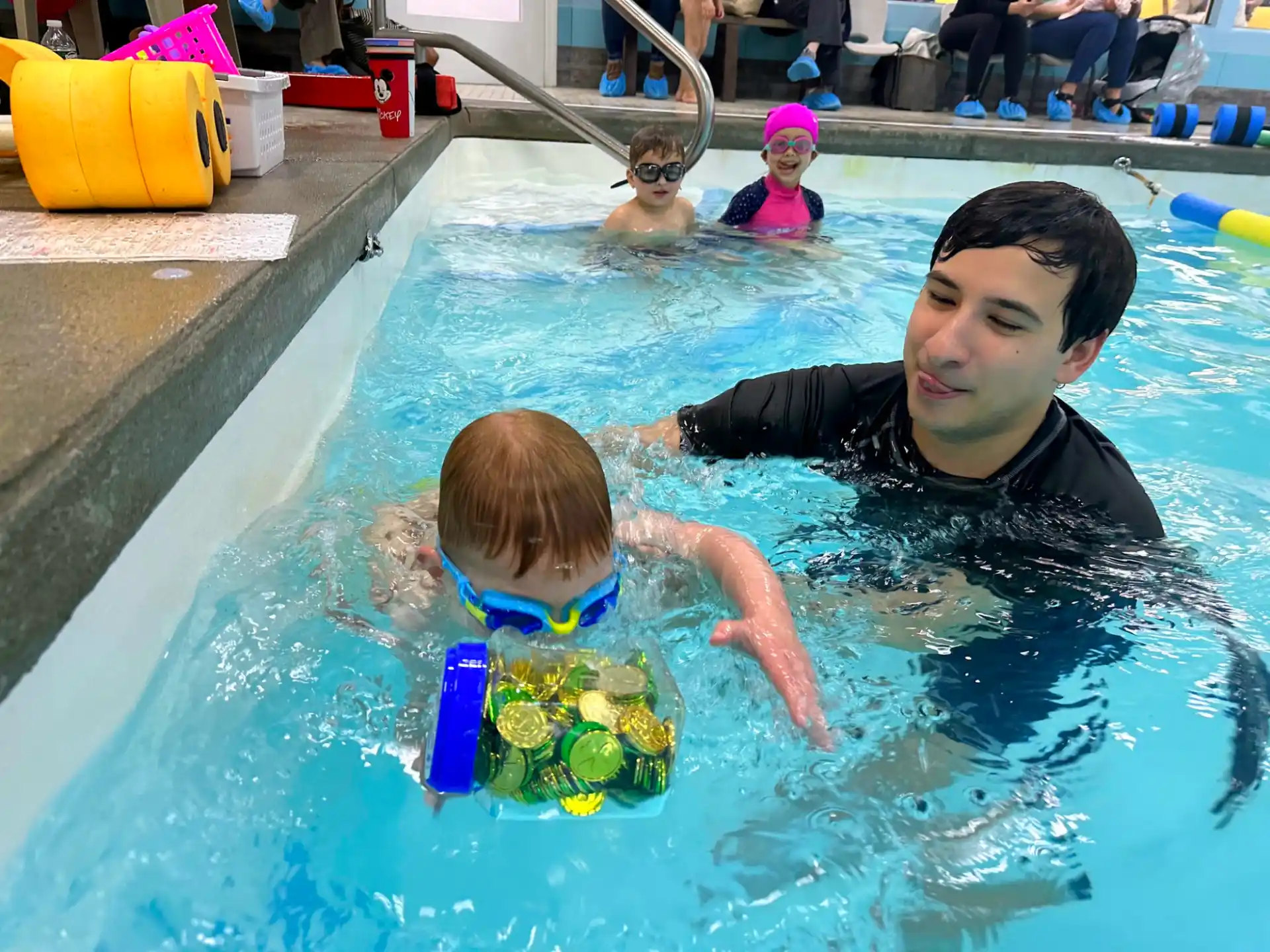 a man and a child in a pool