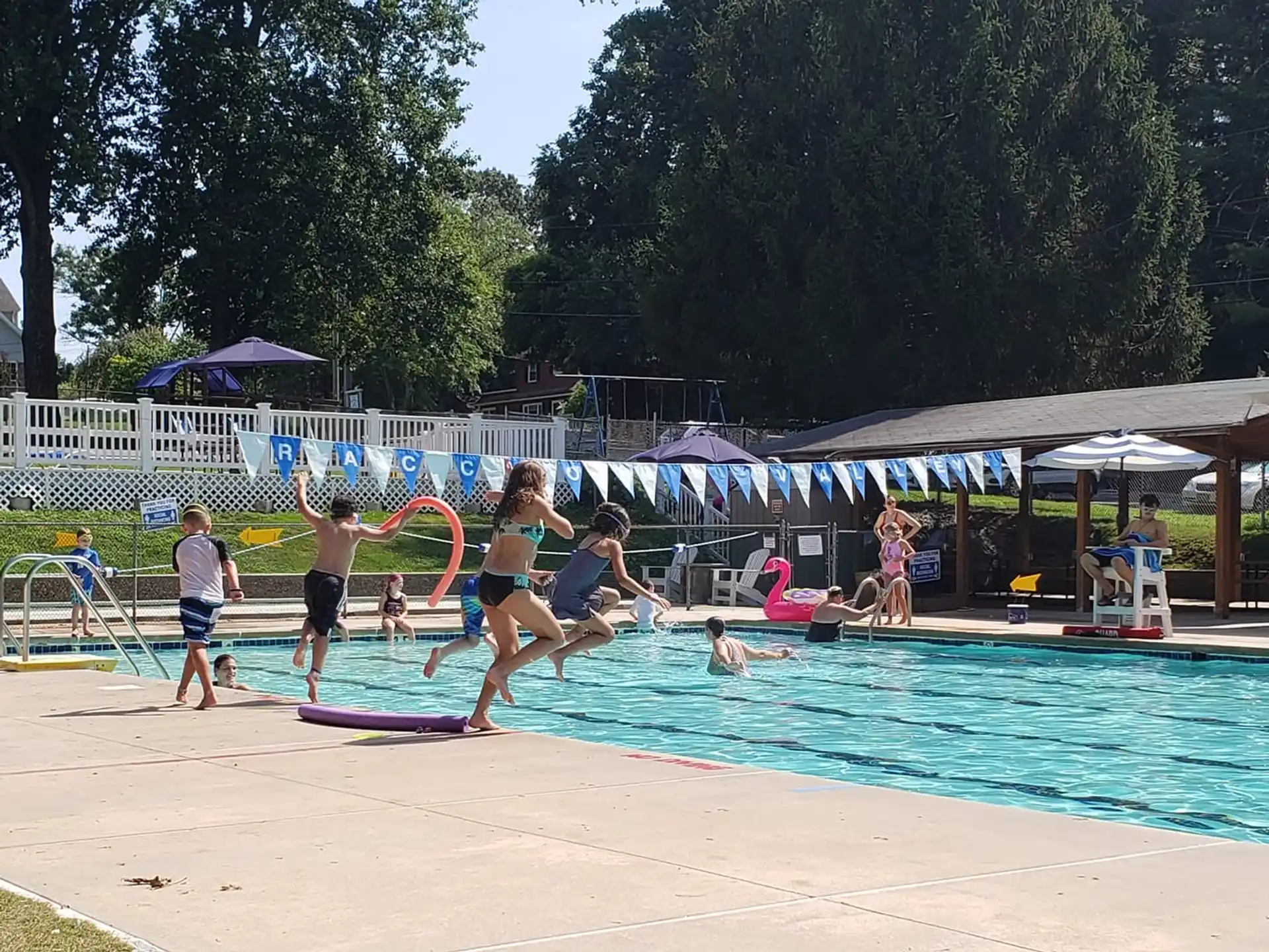 a group of people playing in a swimming pool