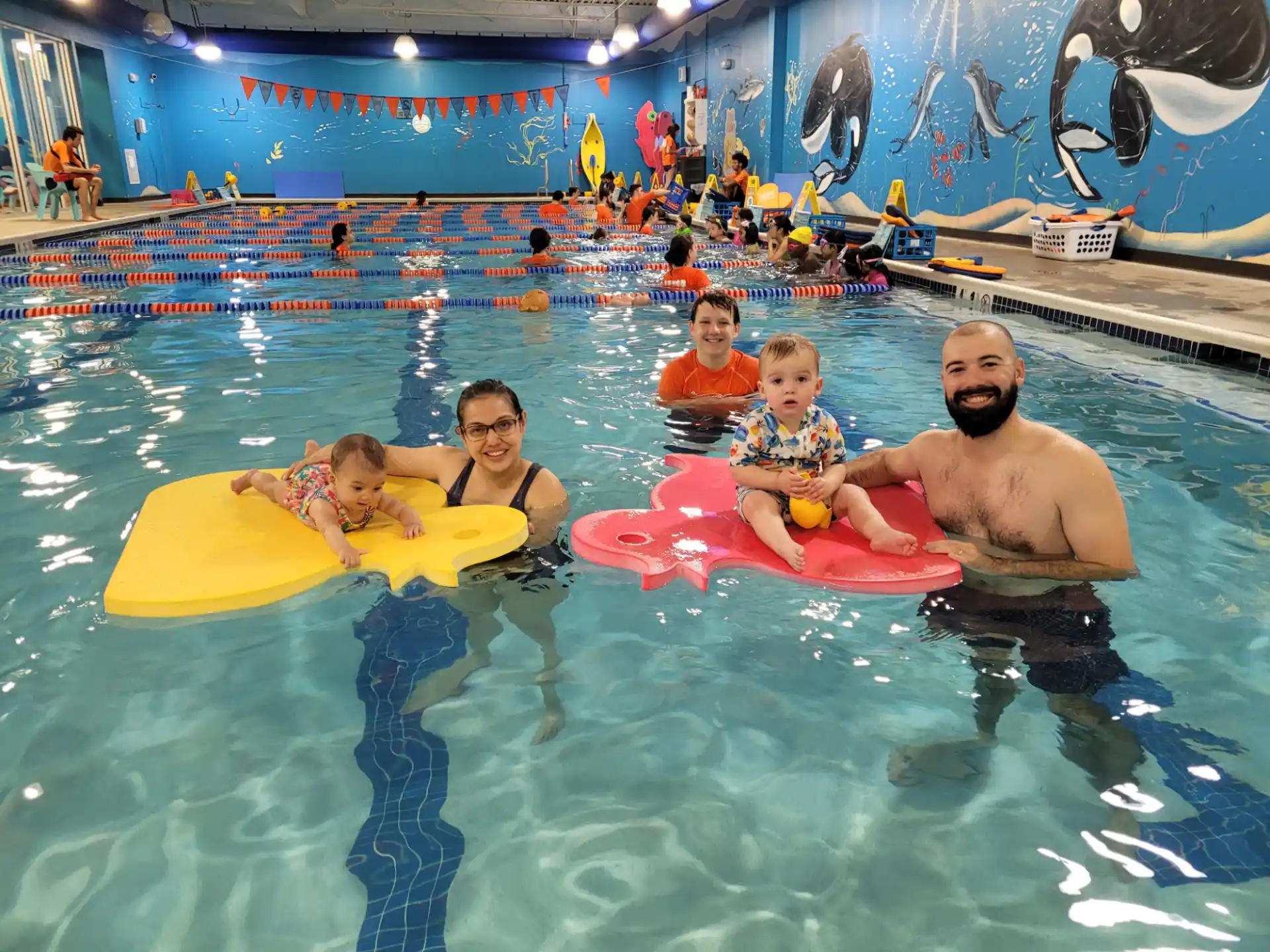 a man and two children in a pool