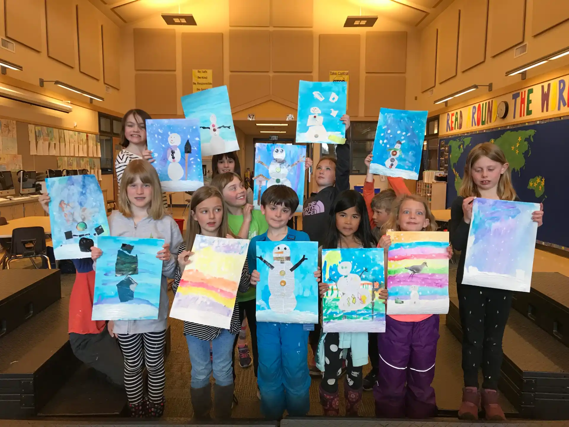 a group of children holding signs
