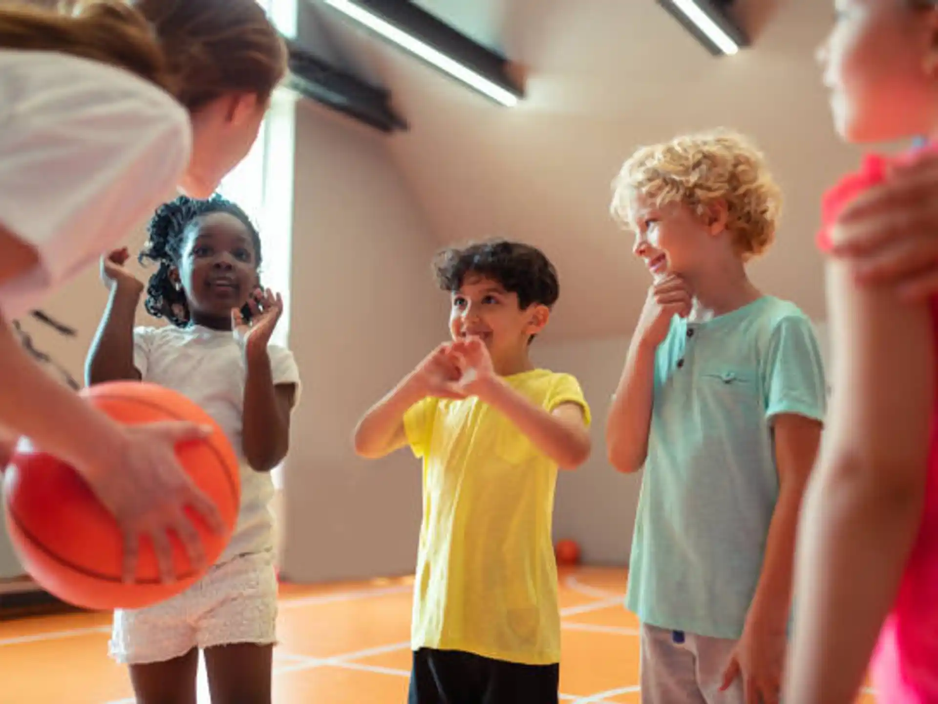 a group of kids playing with a ball