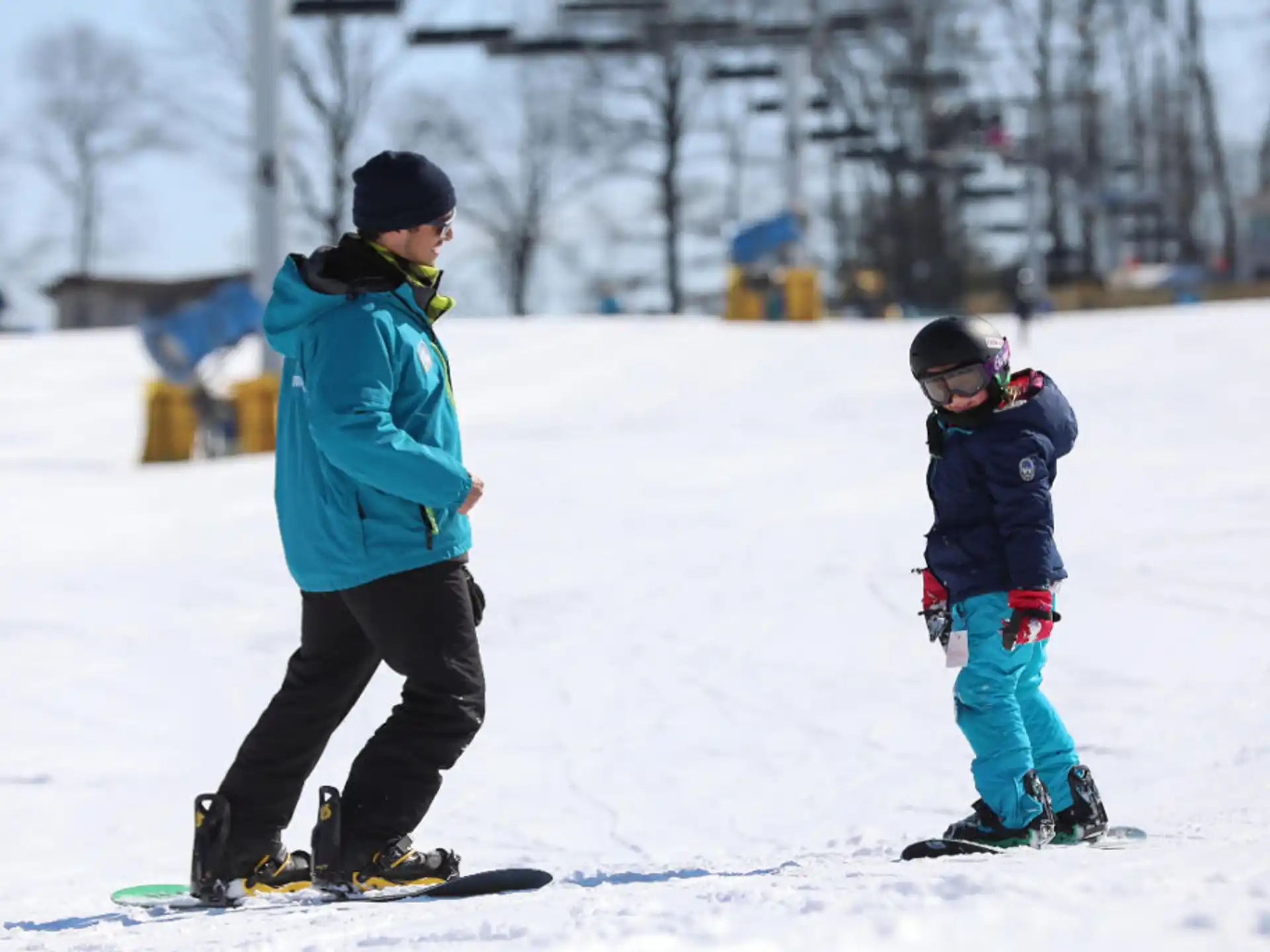 a person and a child skiing