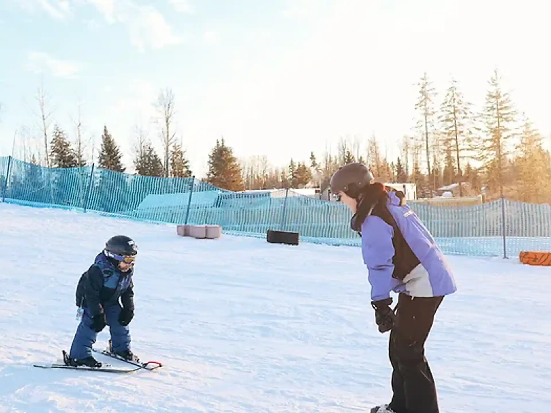 a person and a child skiing