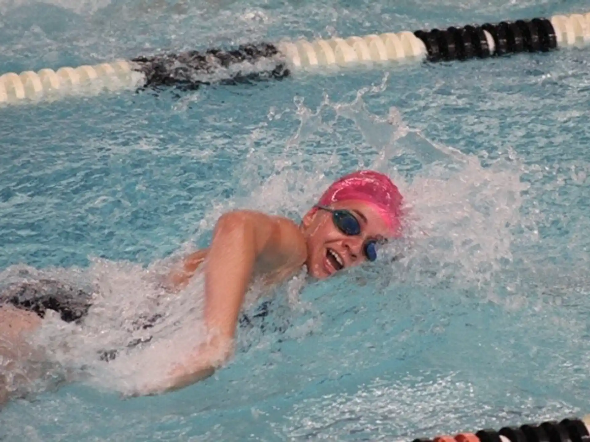 a person swimming in a pool