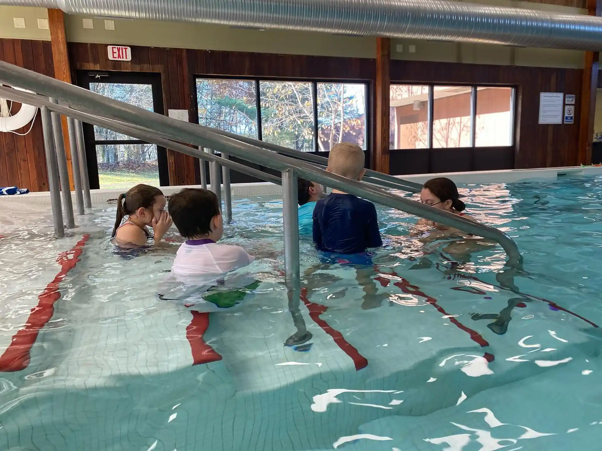 a group of people in a swimming pool