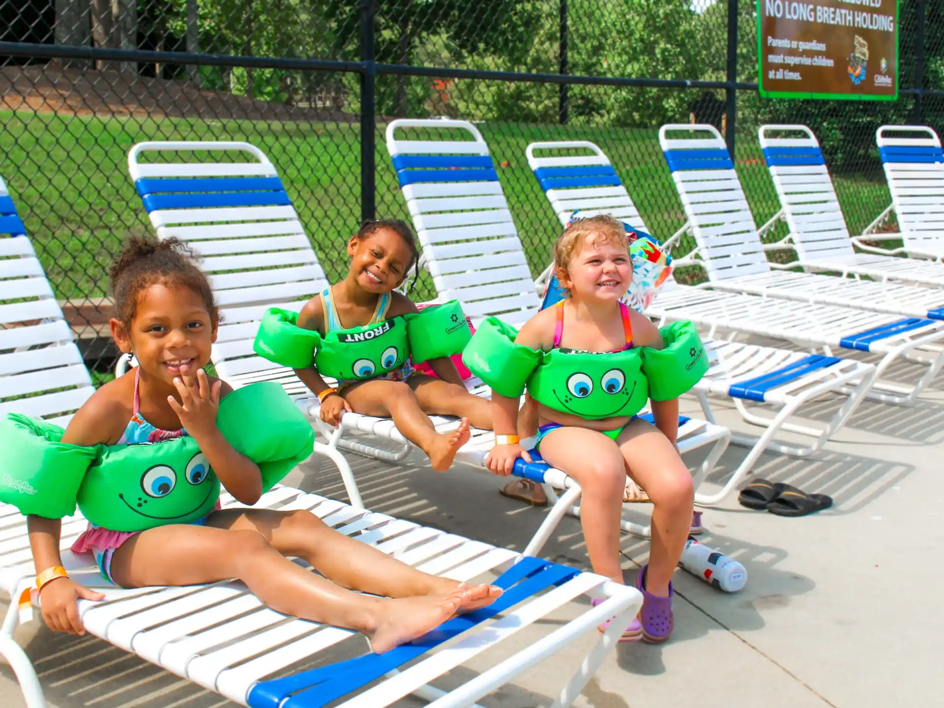 a group of girls sitting in chairs