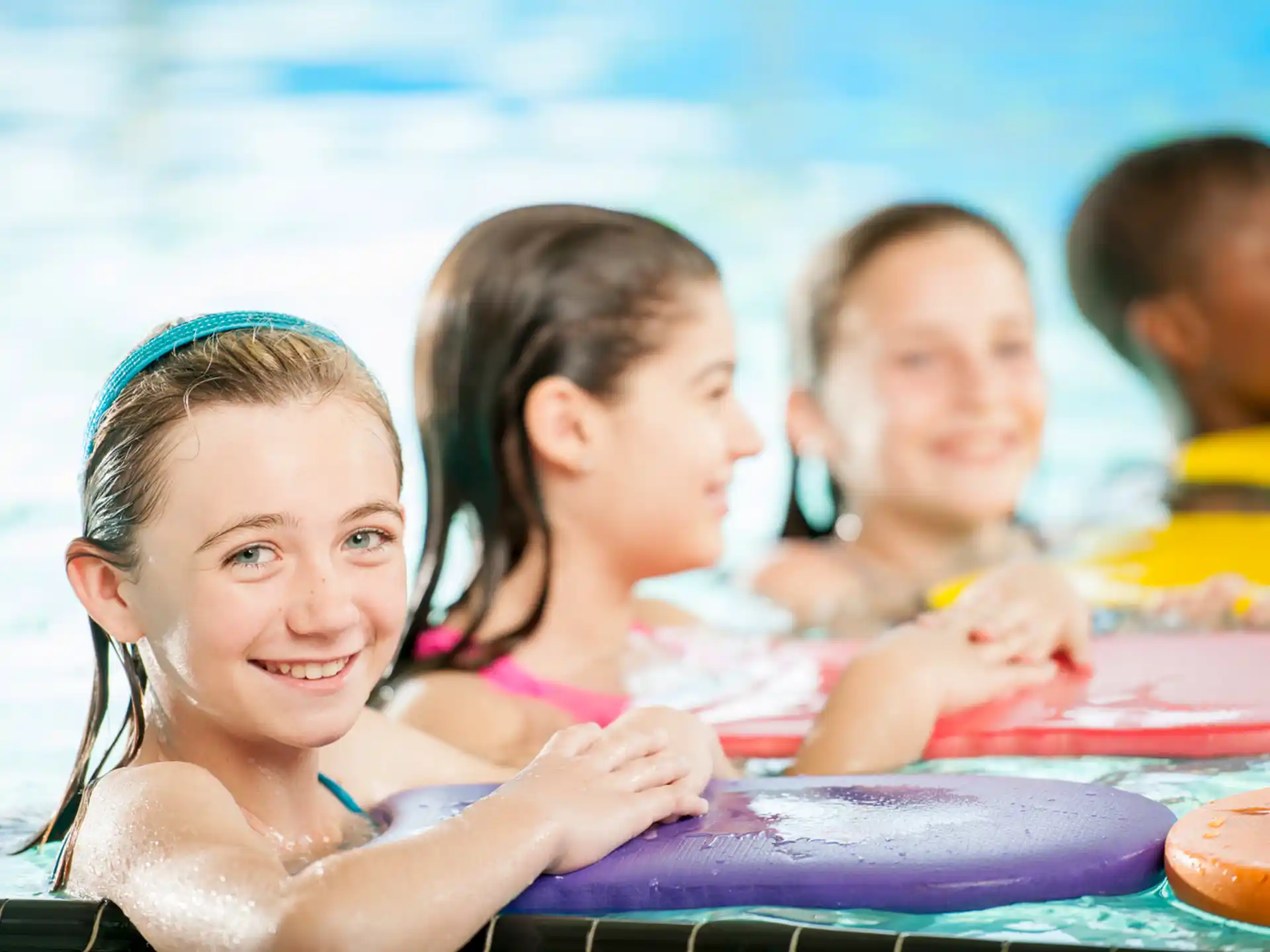 a group of children in a pool