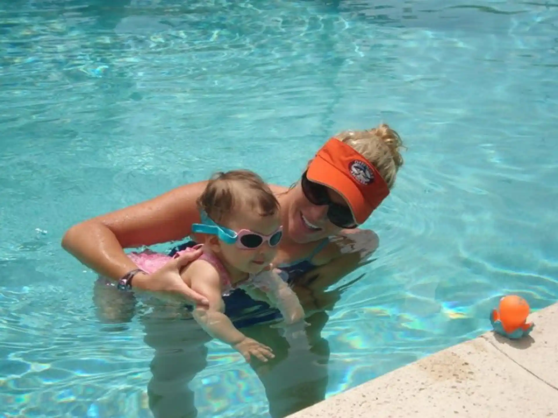 a couple of people in a pool