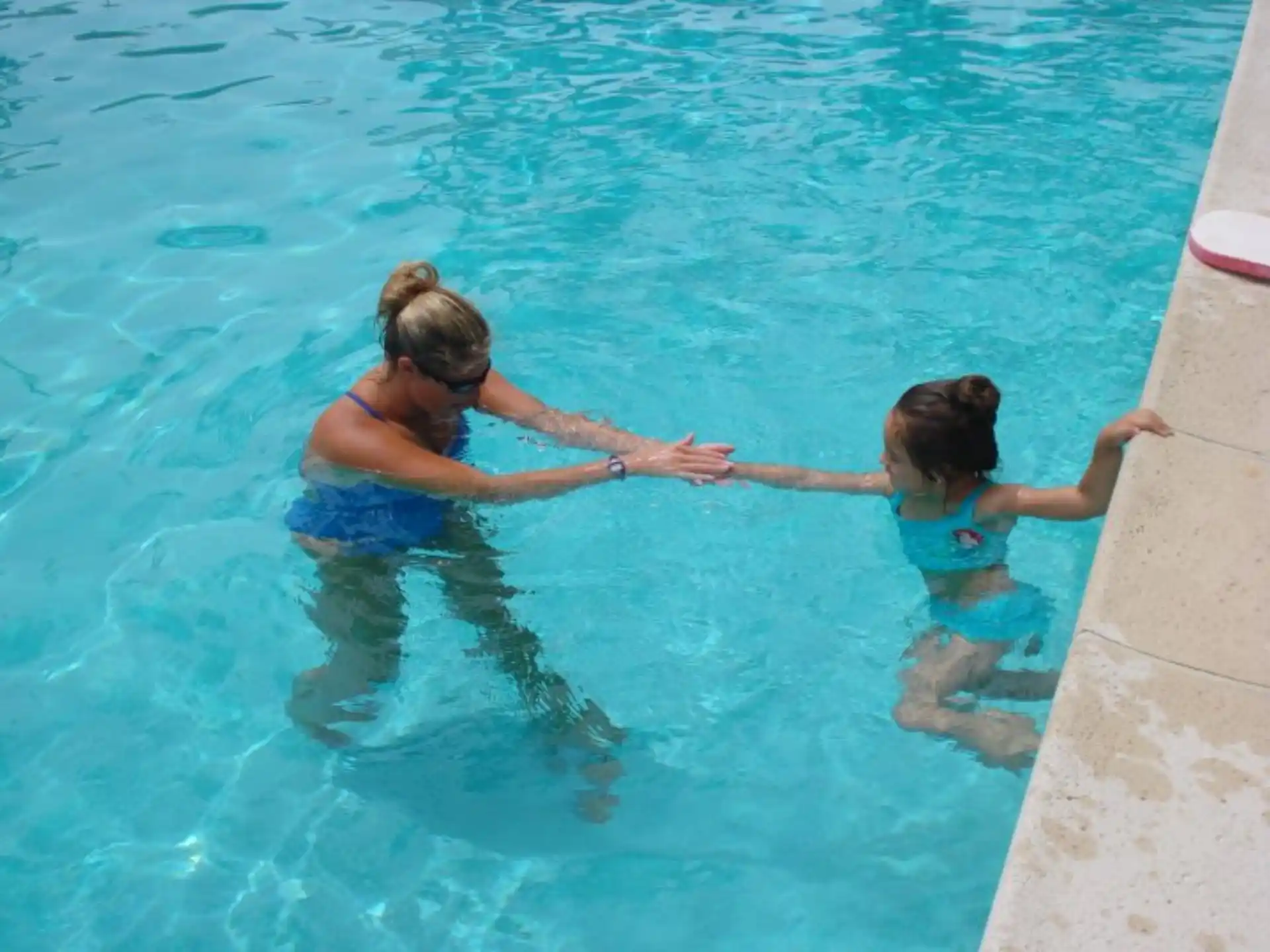 a couple of women in a pool