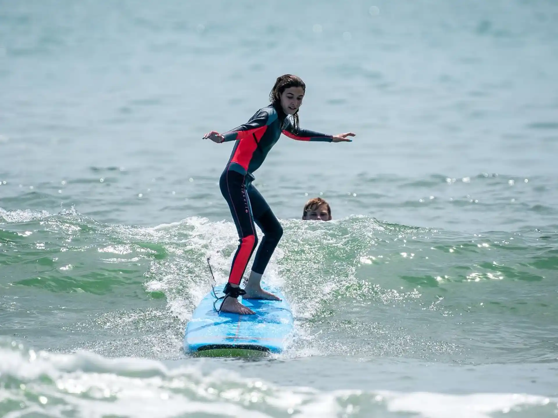 a man riding a surfboard