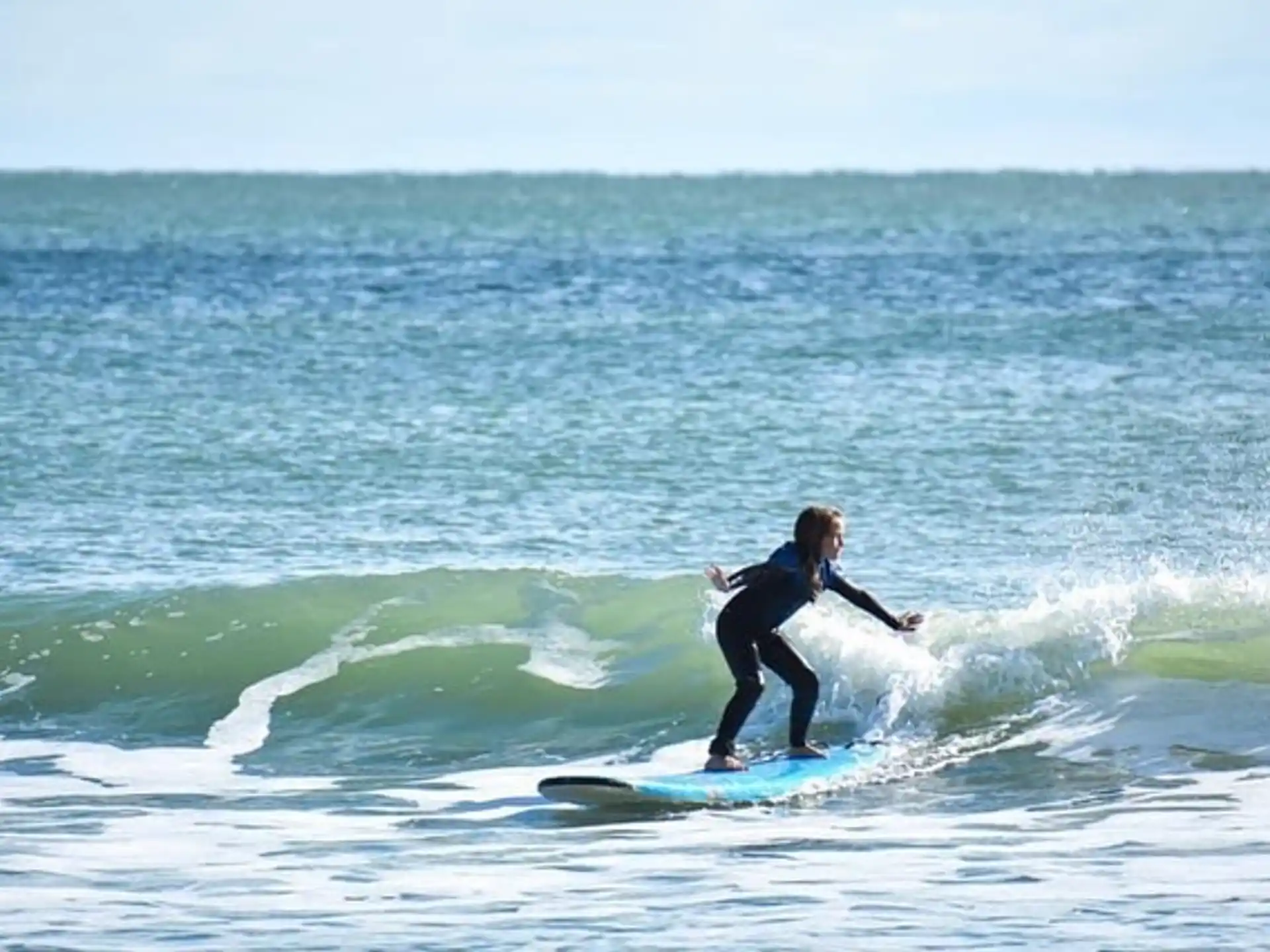 a person surfing on the waves