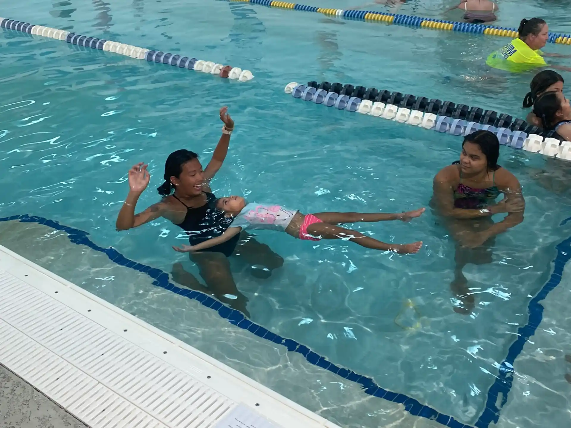 a group of people in a swimming pool