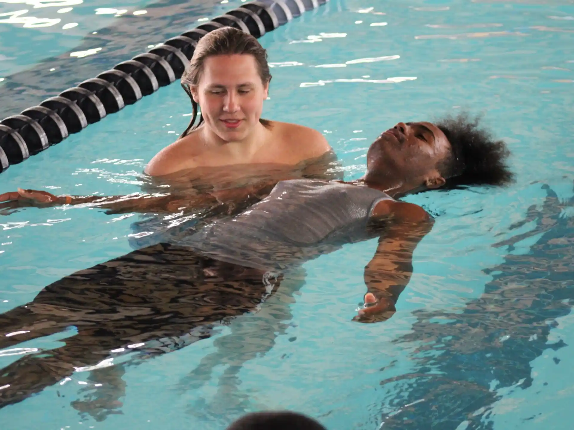 a person and a seal in the water