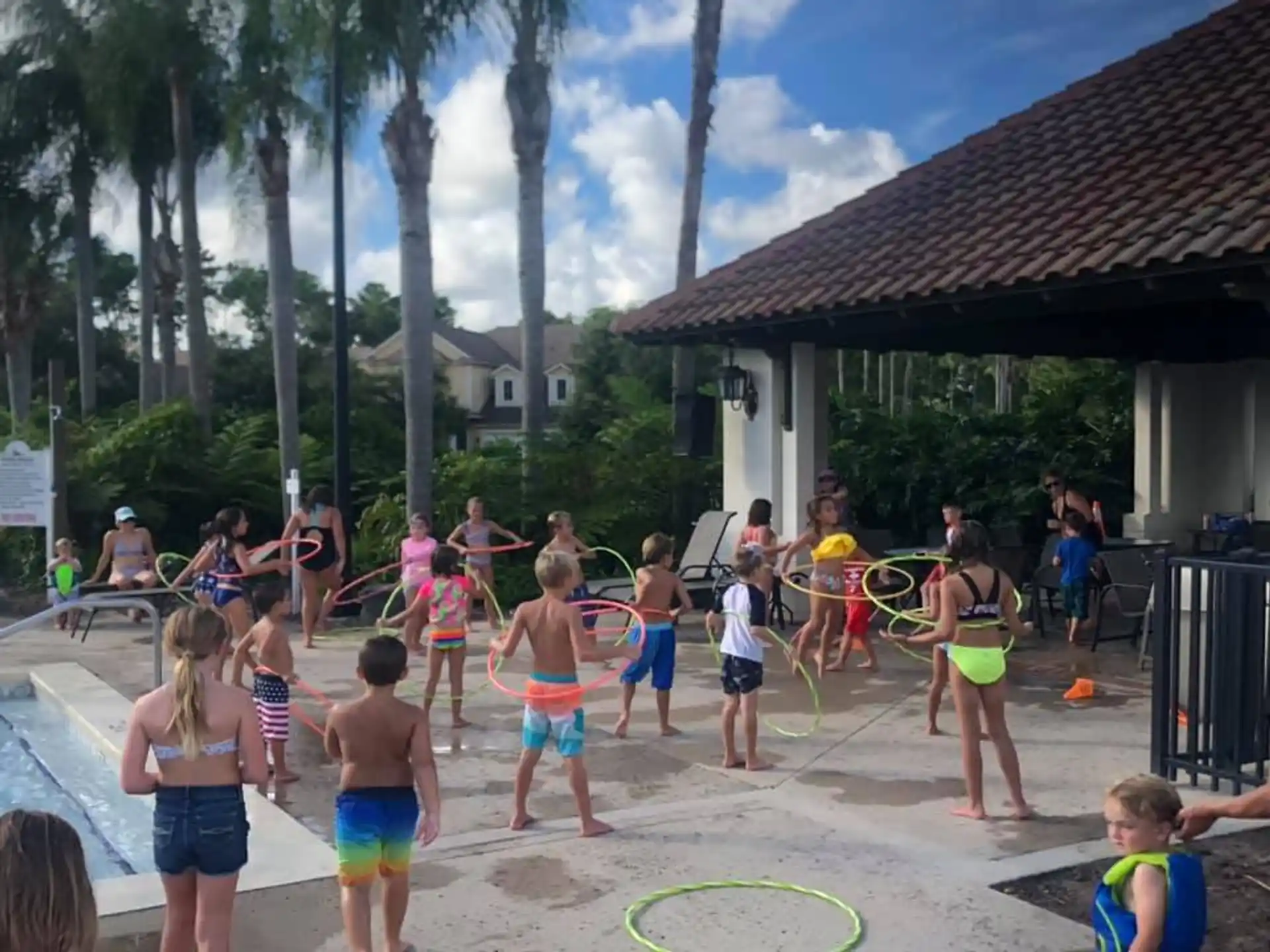 a group of children playing in a water park