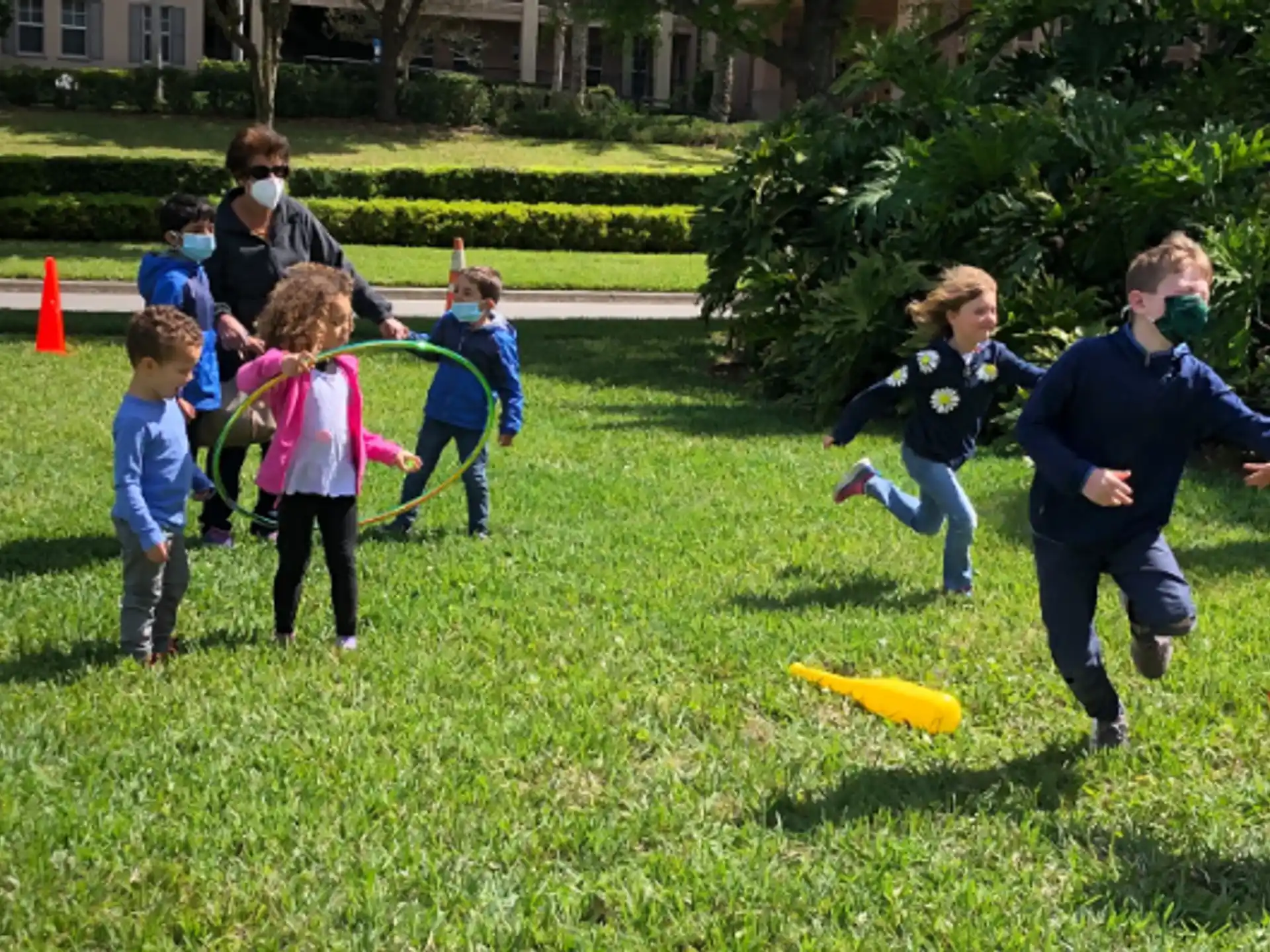 a group of kids playing with a frisbee