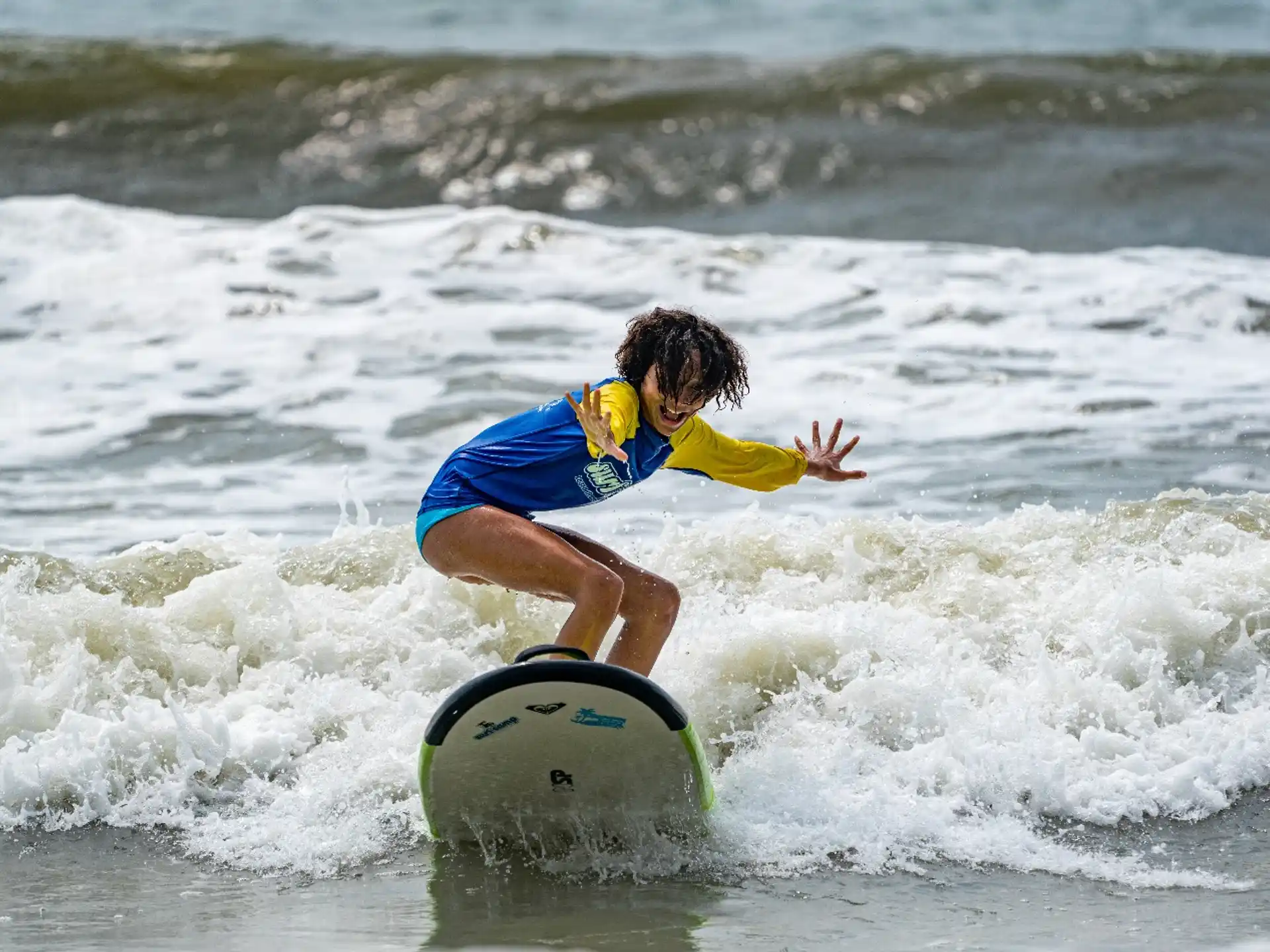 a person surfing on the waves
