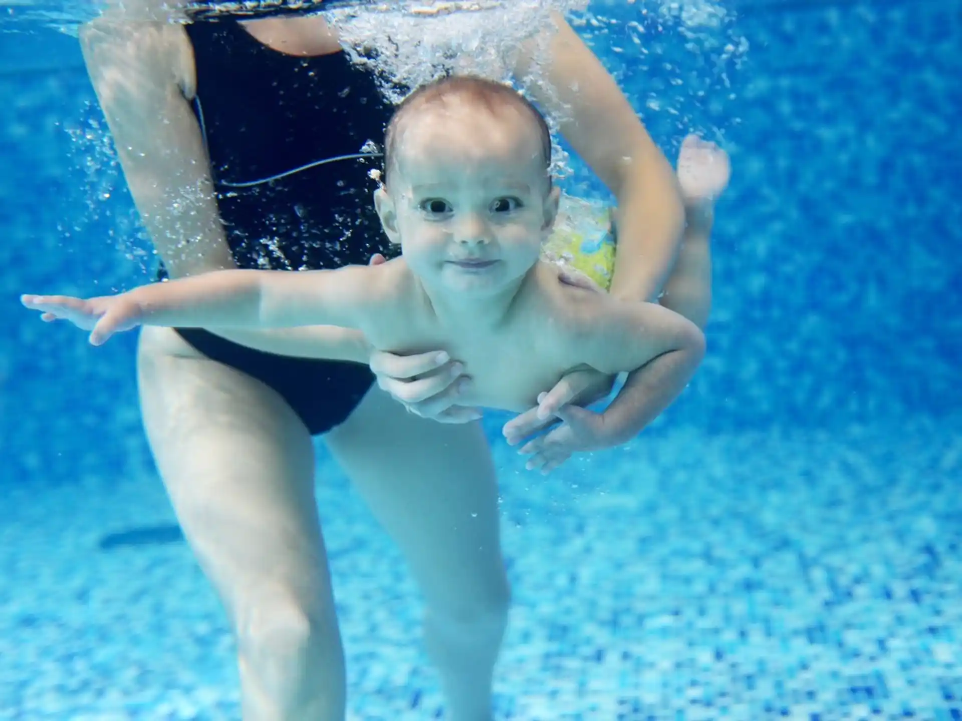 a baby in a pool
