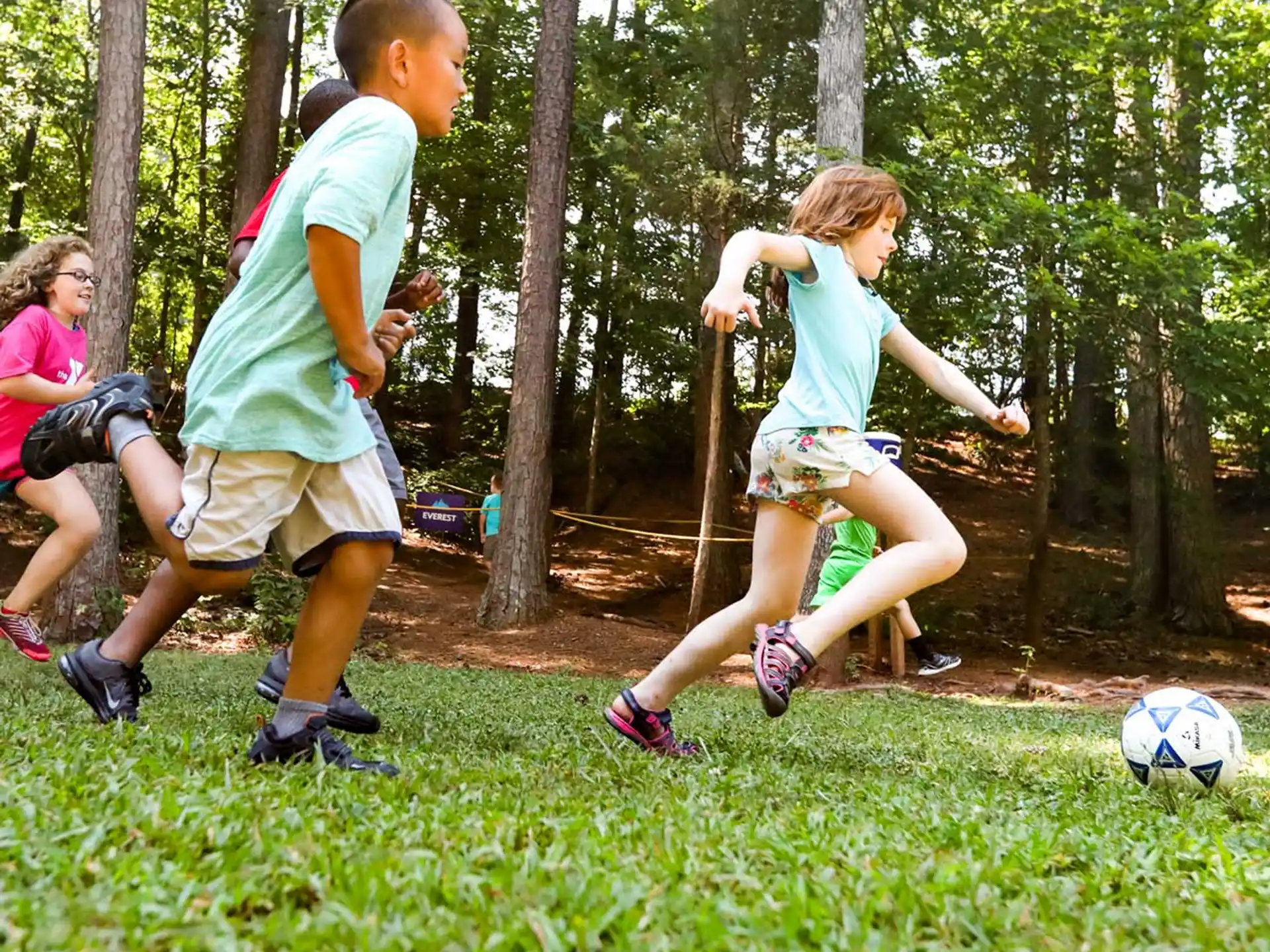 a group of kids playing football
