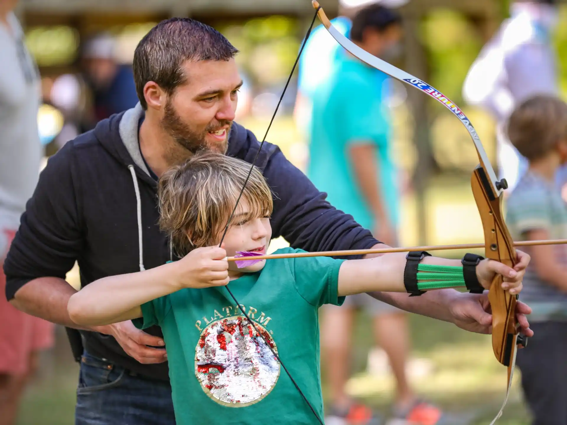 a man and a child playing a violin