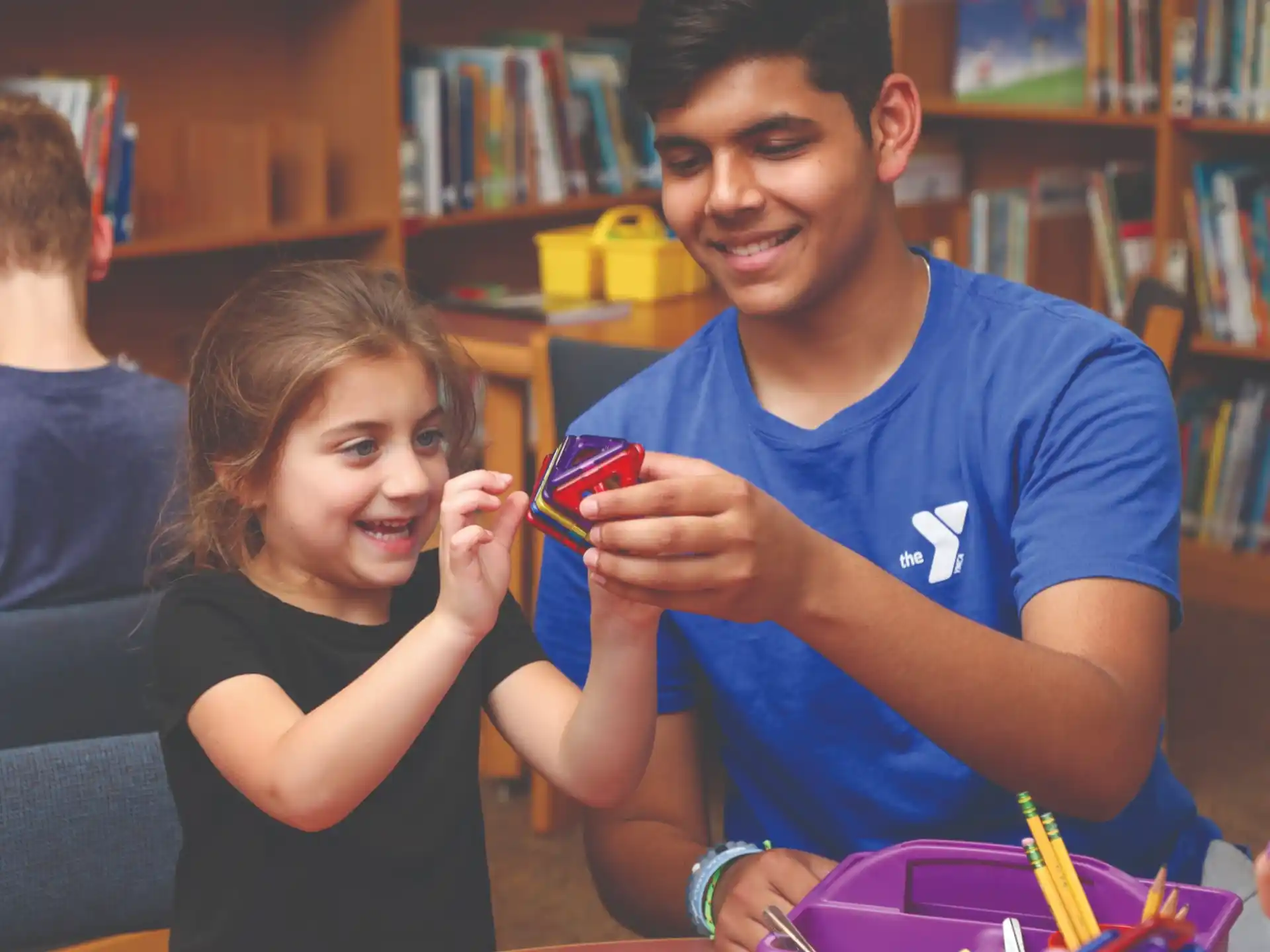 a person and a girl smiling