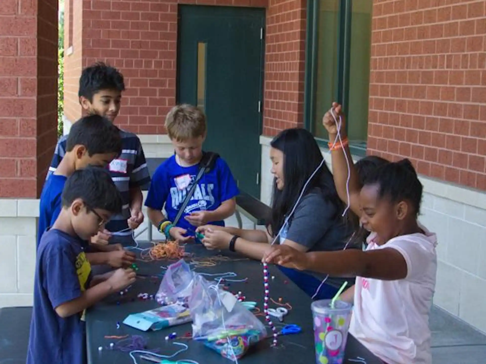 a group of children around a table