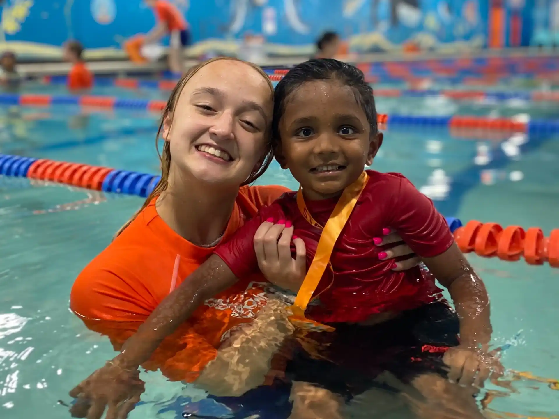 a man and a boy in a pool