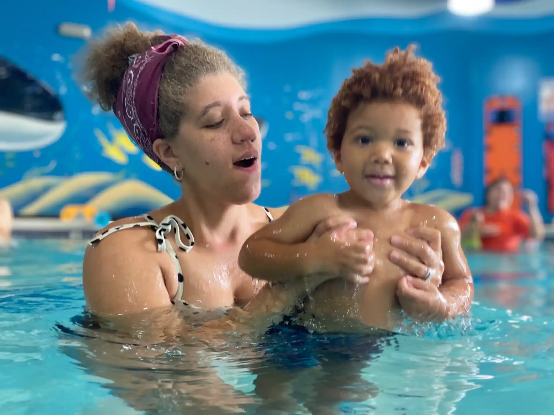 a person and a child in a pool